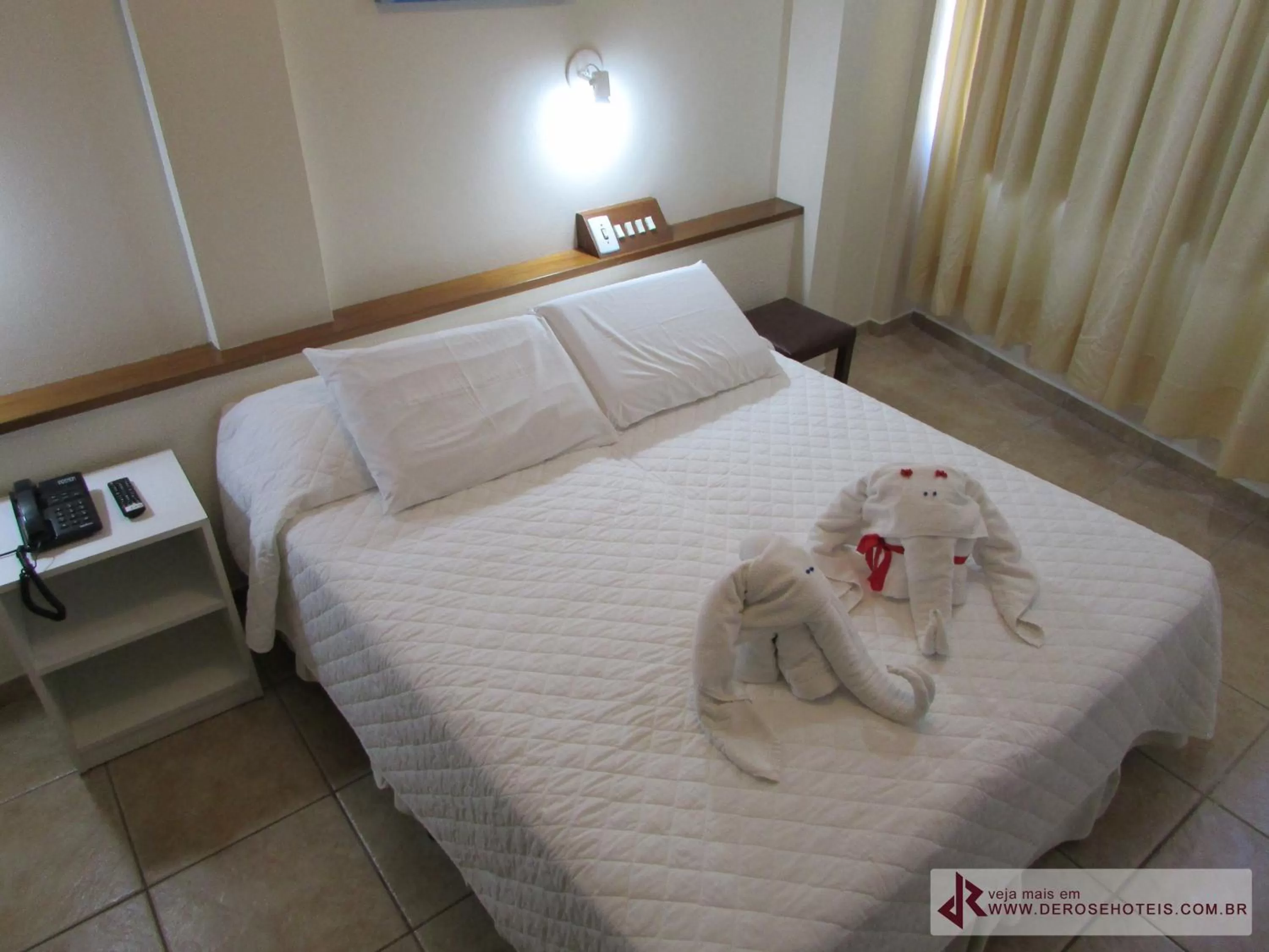 Bed in De Rose Palace Hotel