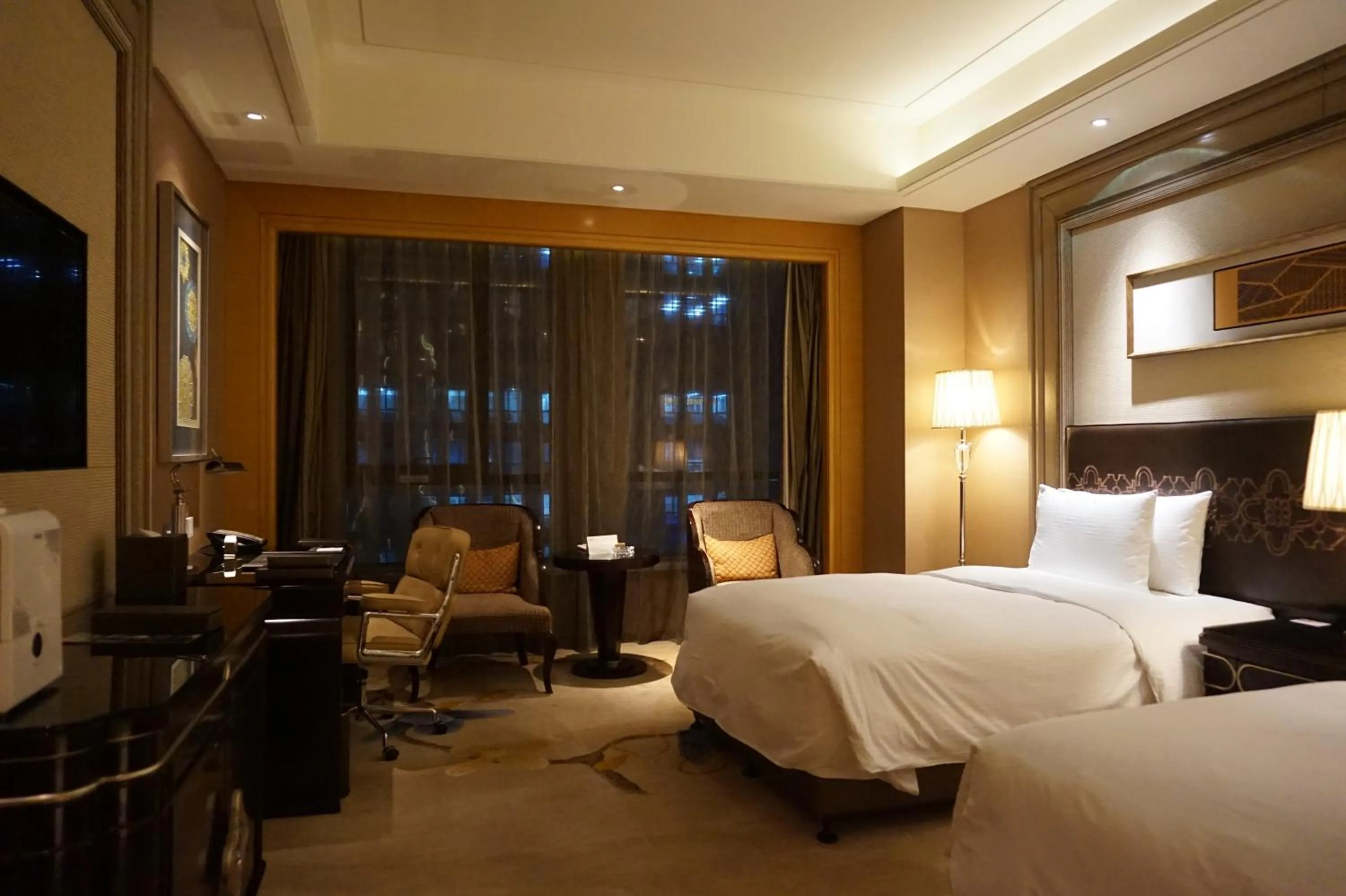 Bed in Wanda Realm Harbin Hotel