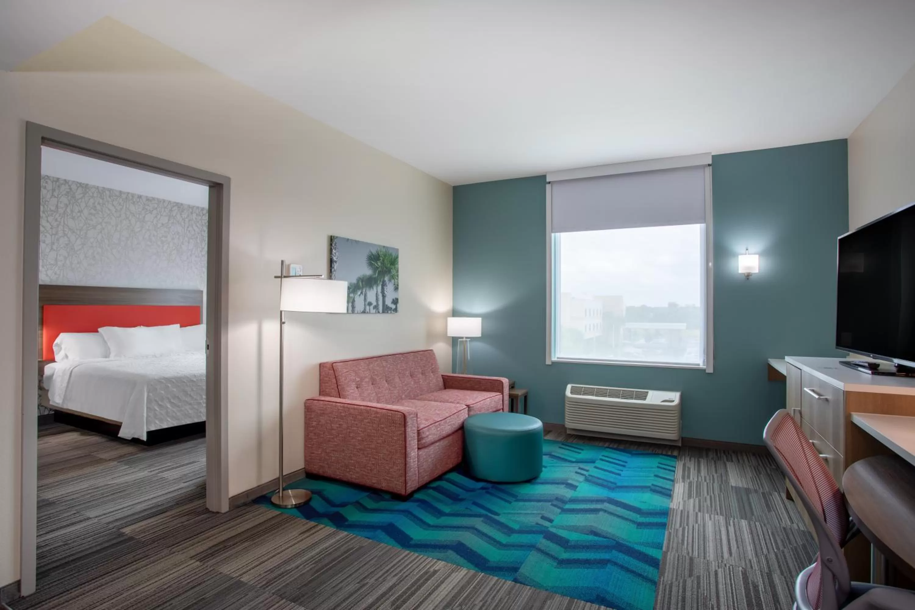 Living room, Bed in Home2 Suites By Hilton Vero Beach I-95