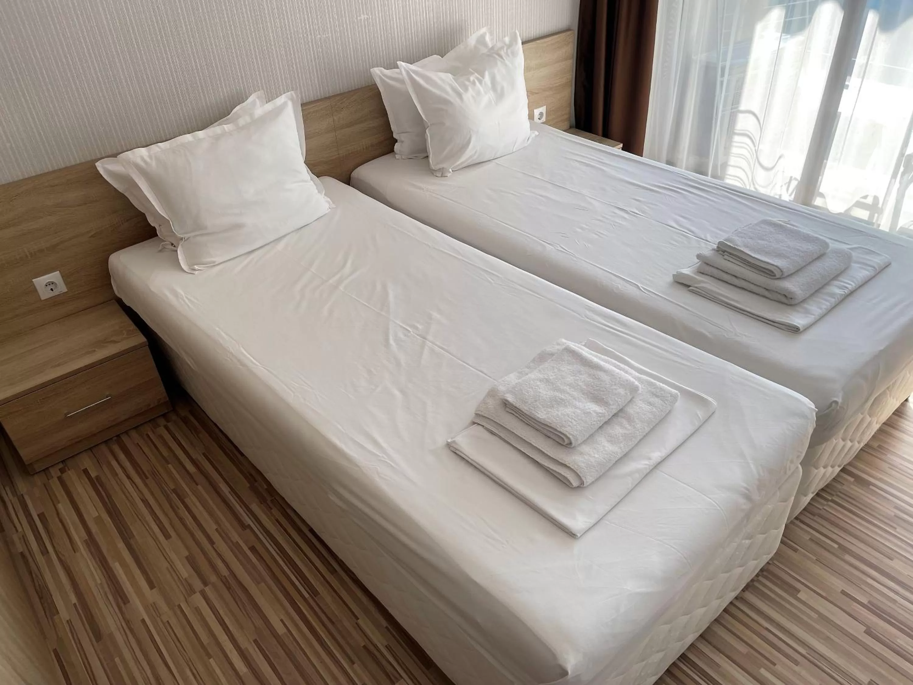 Bed in APART-HOTEL Stamopolu Lux с изглед към морето