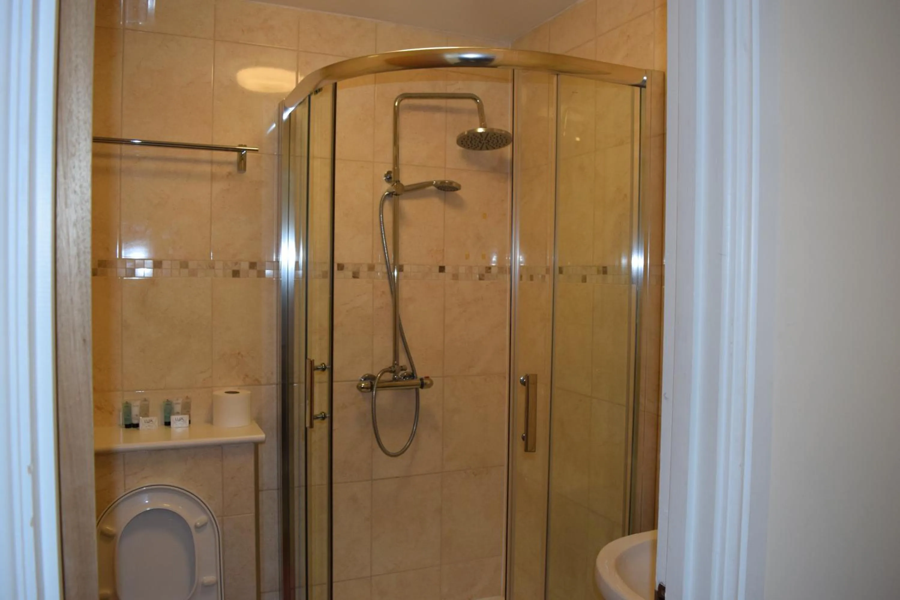 Bathroom in Star Anglia Hotel City Center by OYO