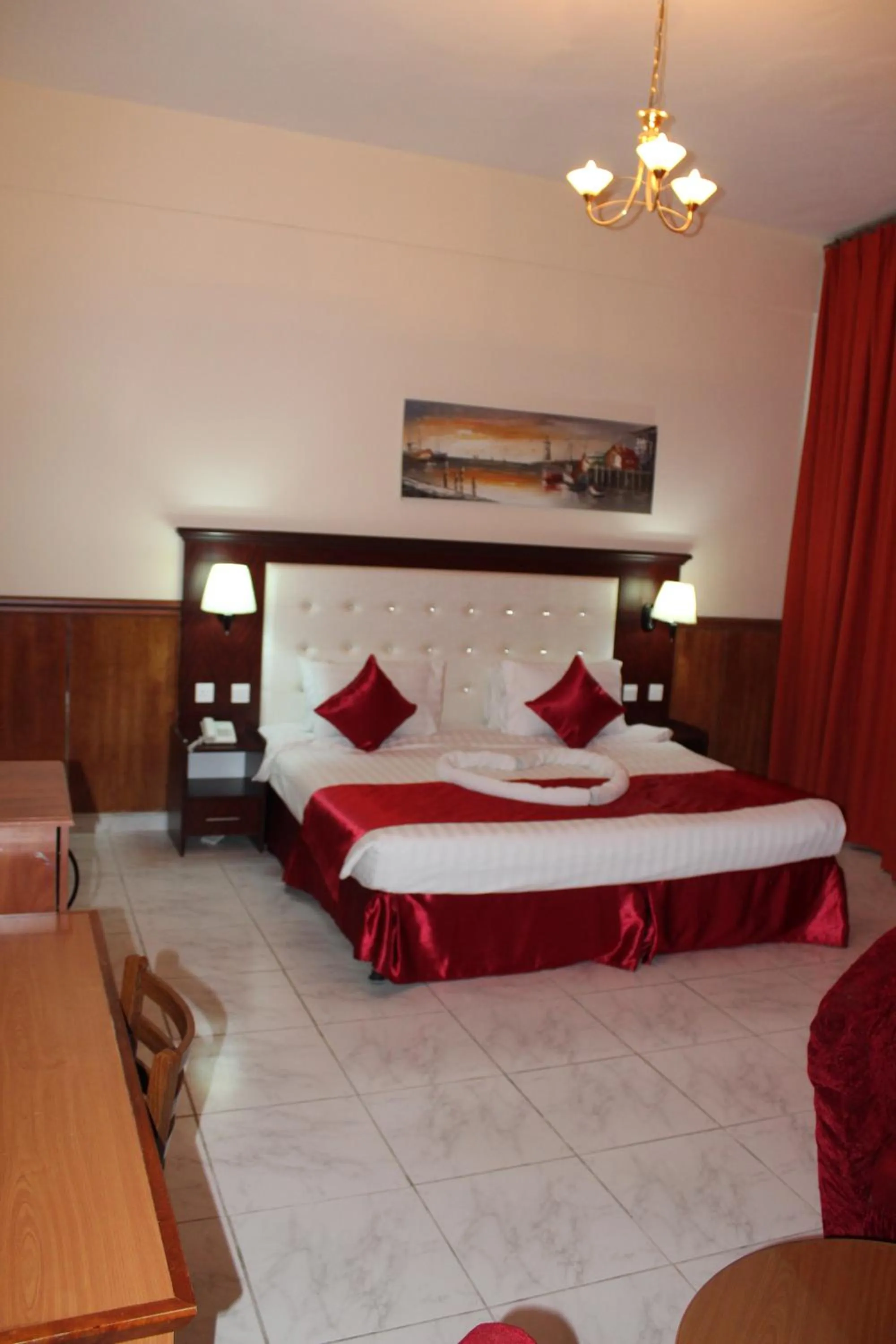 Bed in Grand Nova Hotel