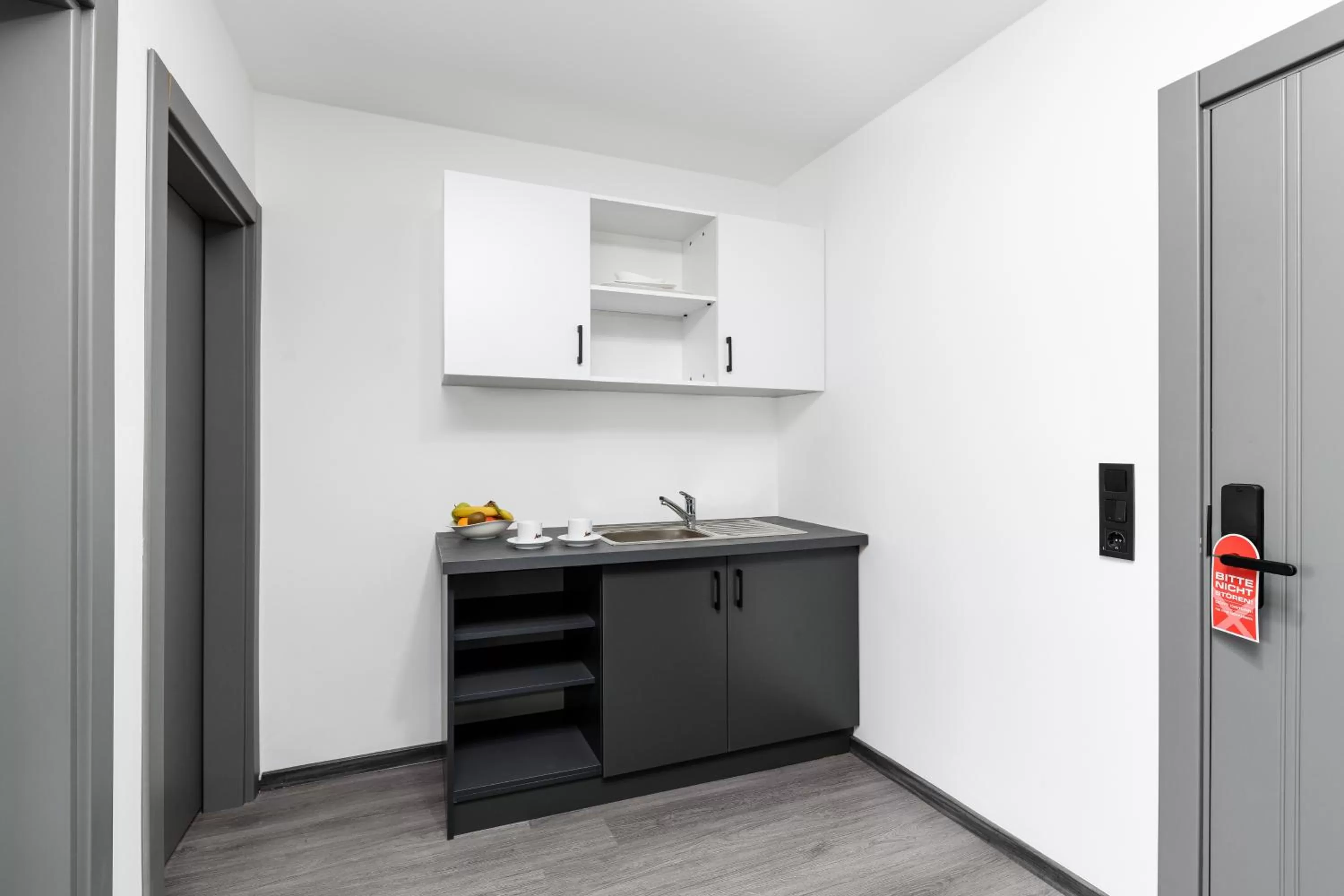 Kitchen or kitchenette in PARKHOTEL BRAUNAU - 24 Stunden Self Check-IN