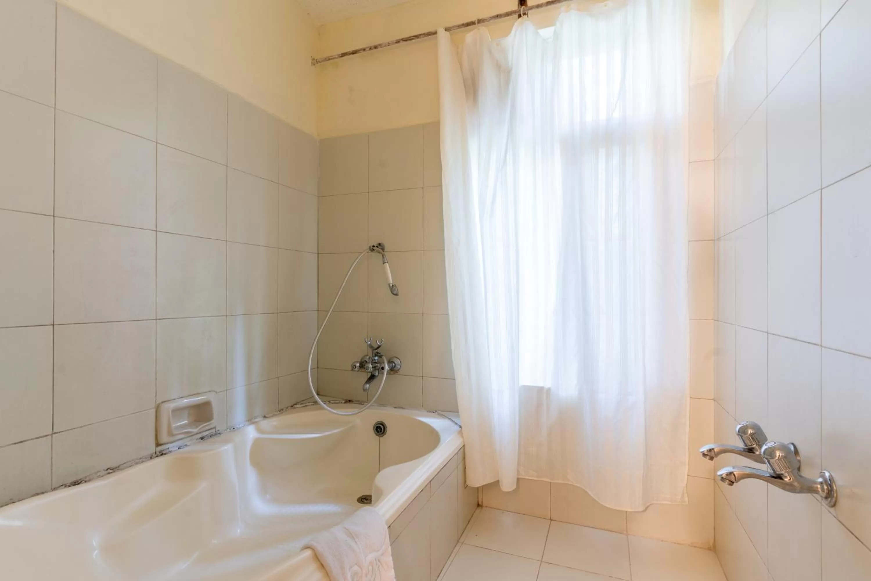 Shower in Hotel Negi's Mayflower A heritage Since 1965