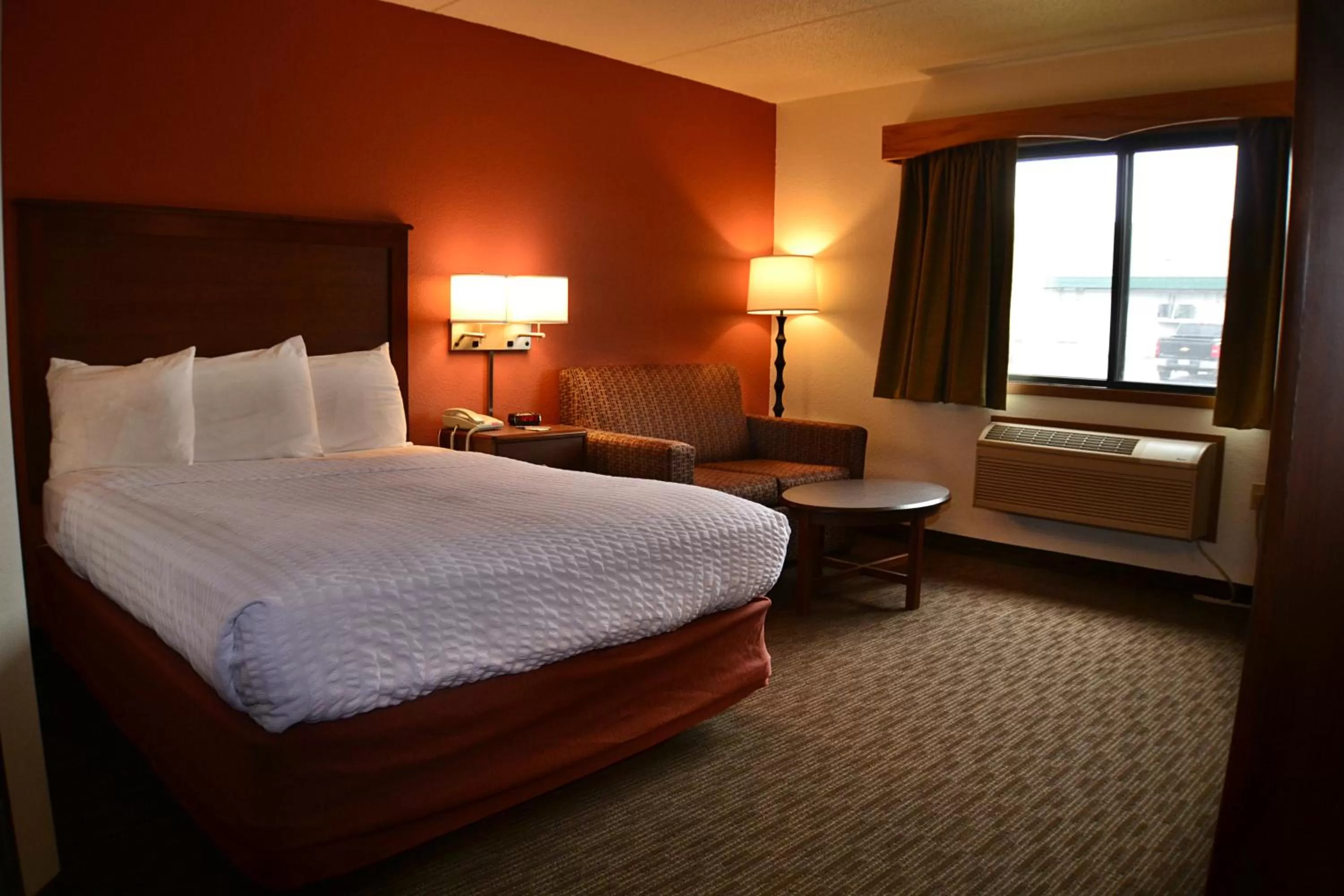 Bed in AmericInn by Wyndham Calumet