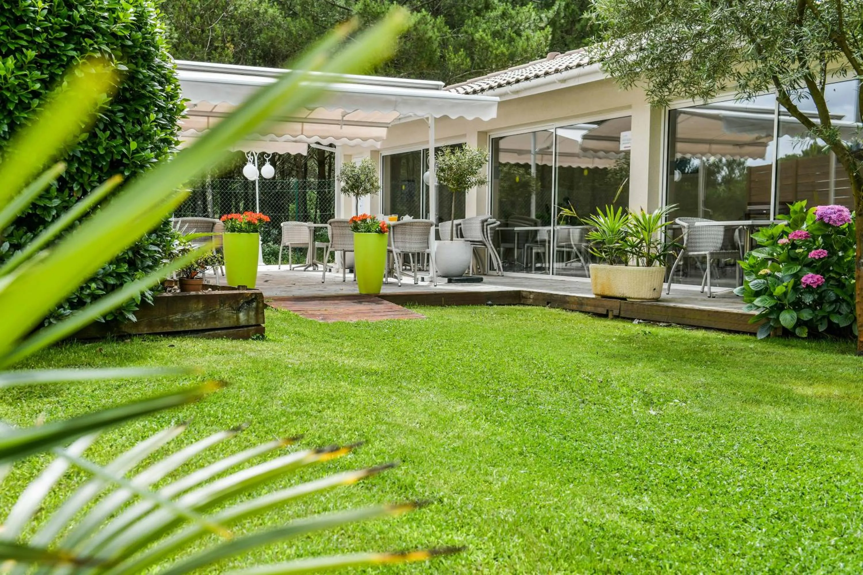 Garden view in Hôtel Restaurant La Forestière