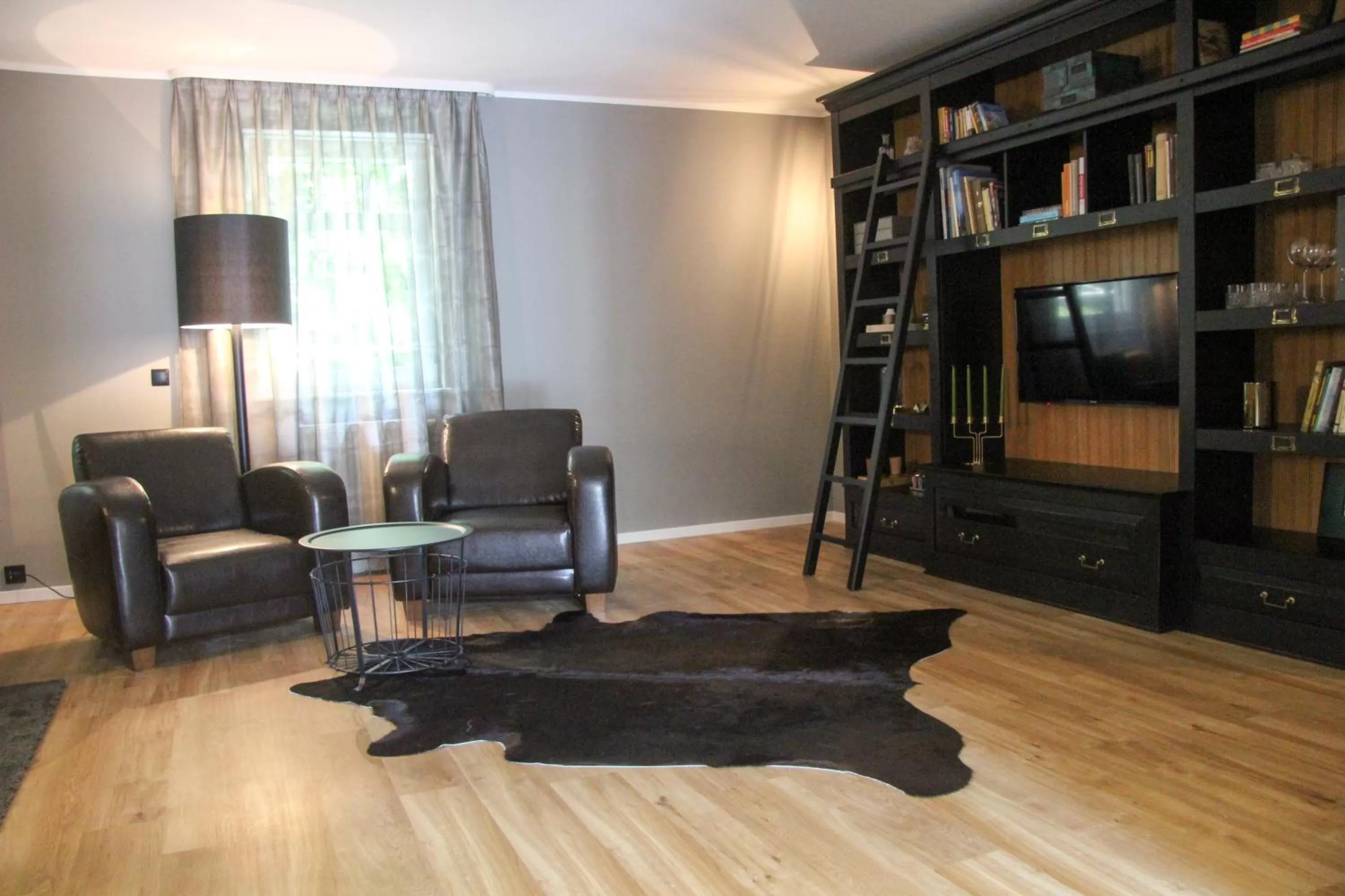 Communal lounge/ TV room in Schlossberghotel Greiz