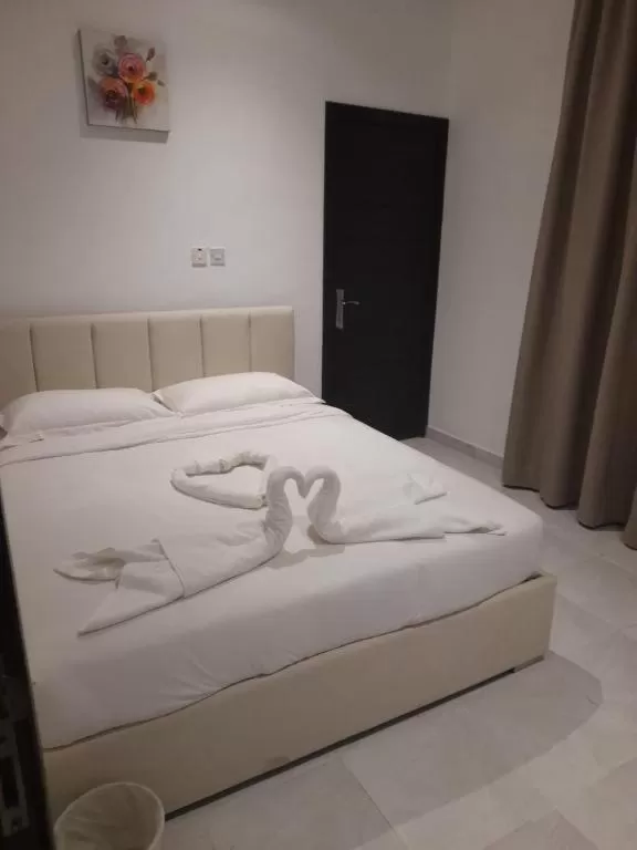 Bed in Atlantis Suites Hotel