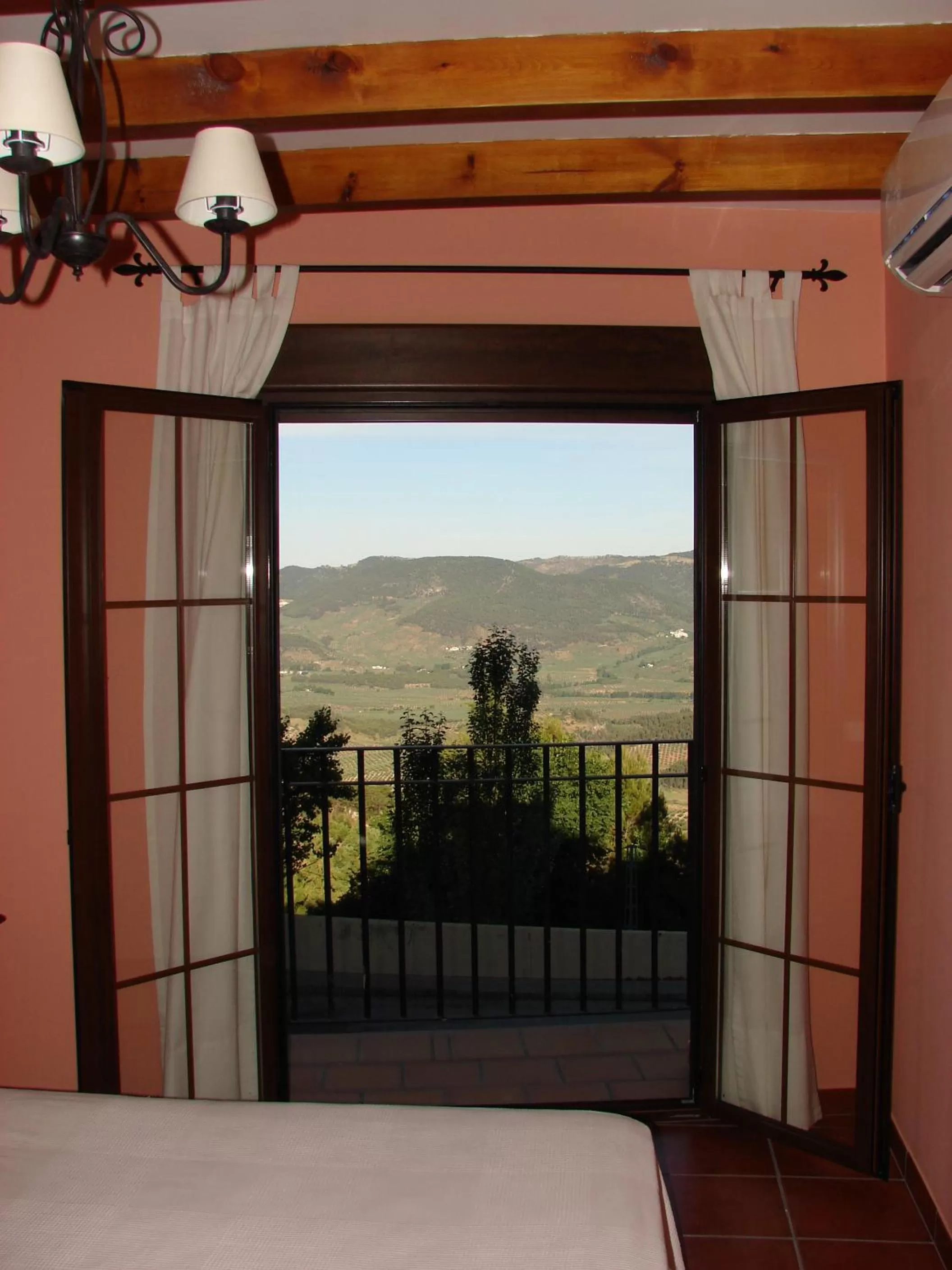 Balcony/Terrace, Bed in Apartamentos Sierra de Segura