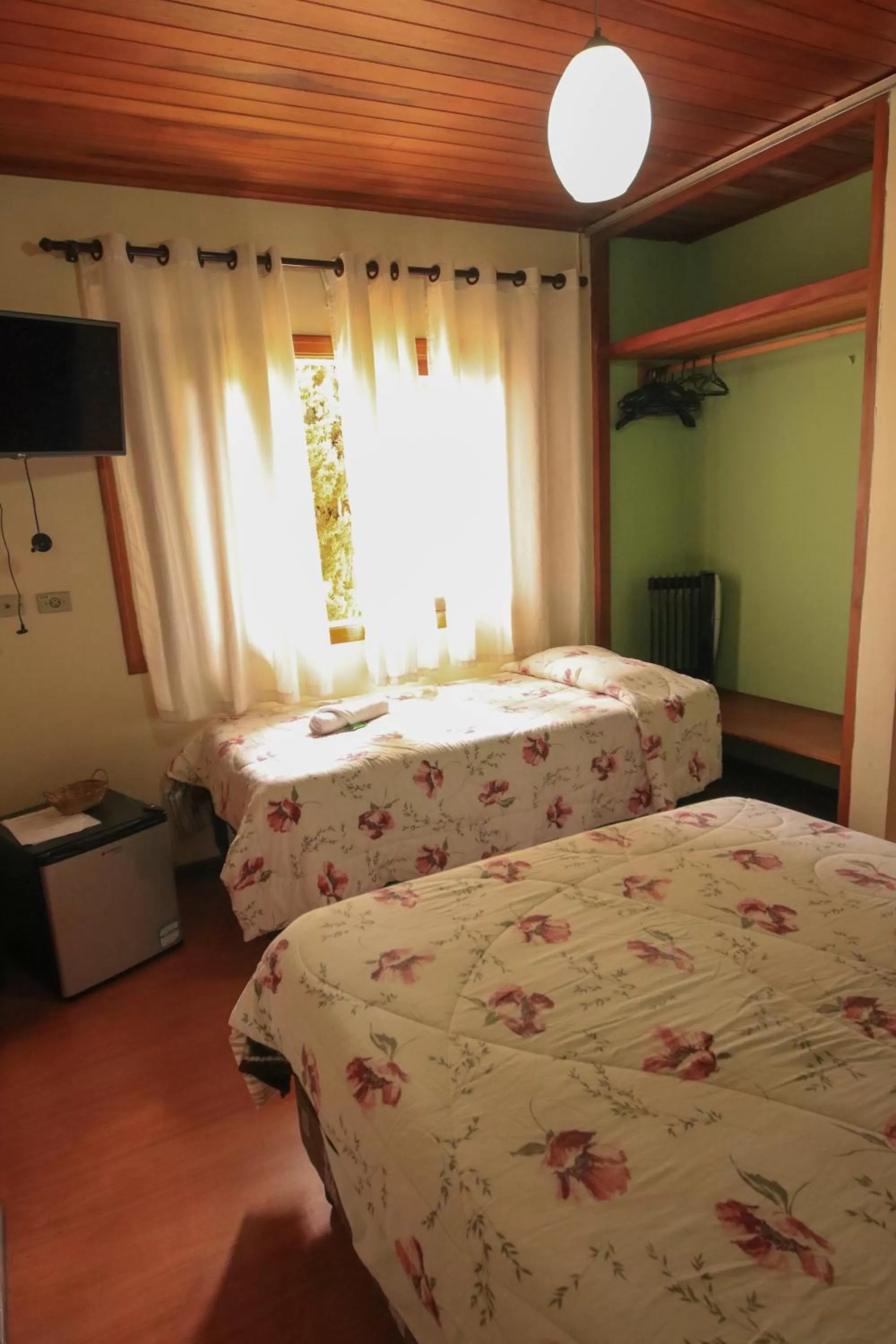 Bed in Pousada Curumi