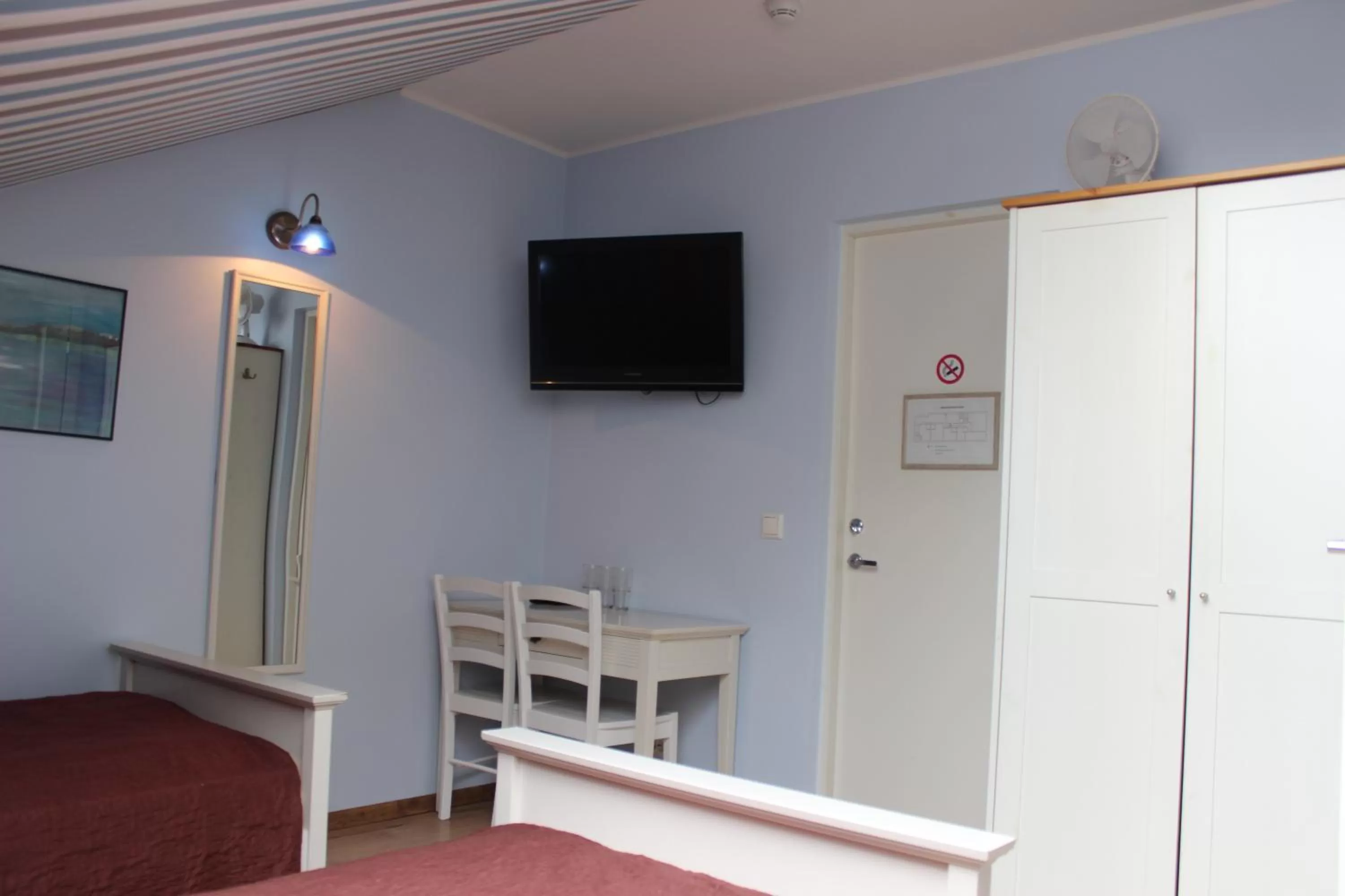 Bedroom, TV/Entertainment Center in Guesthouse Mõisa Ait