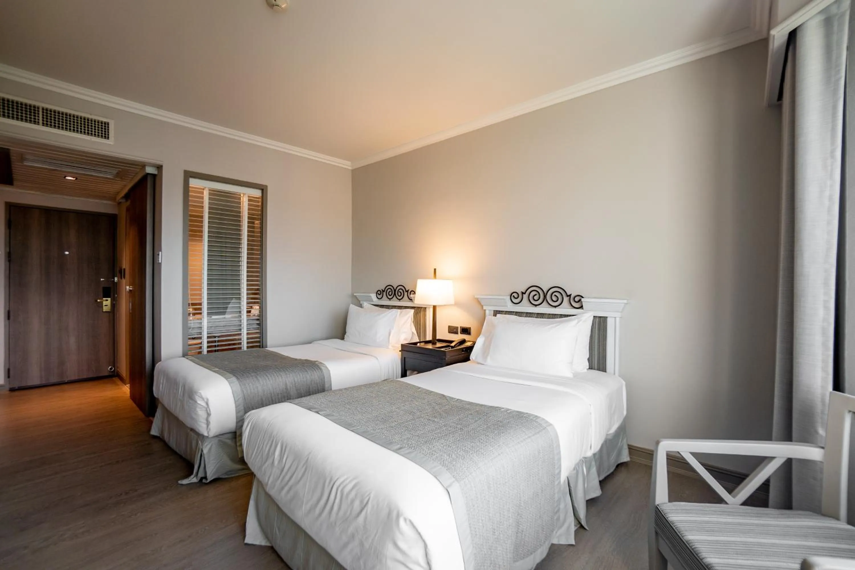 Bed in The Grand Riverside Hotel