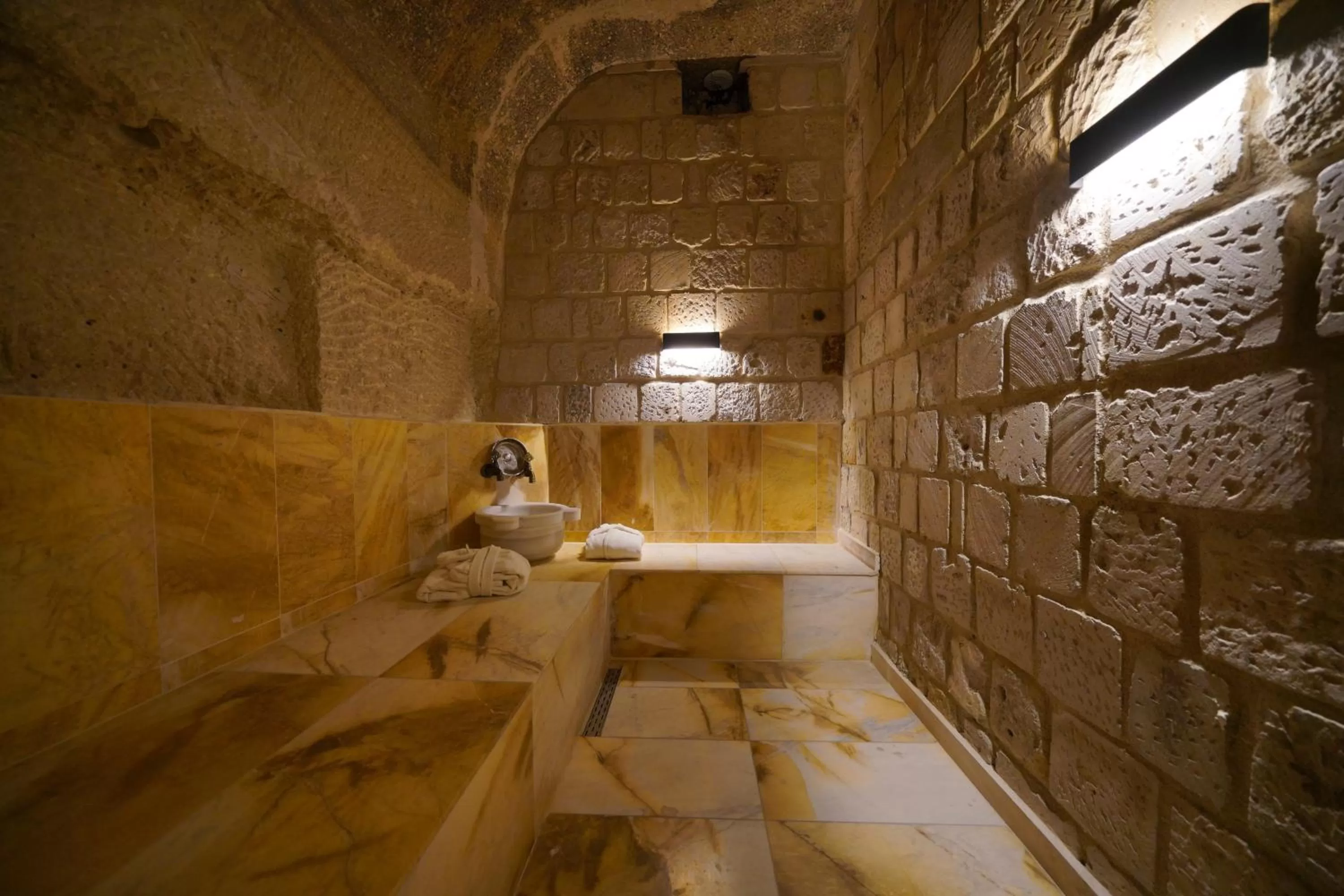 Public Bath in Shoestring Cave House
