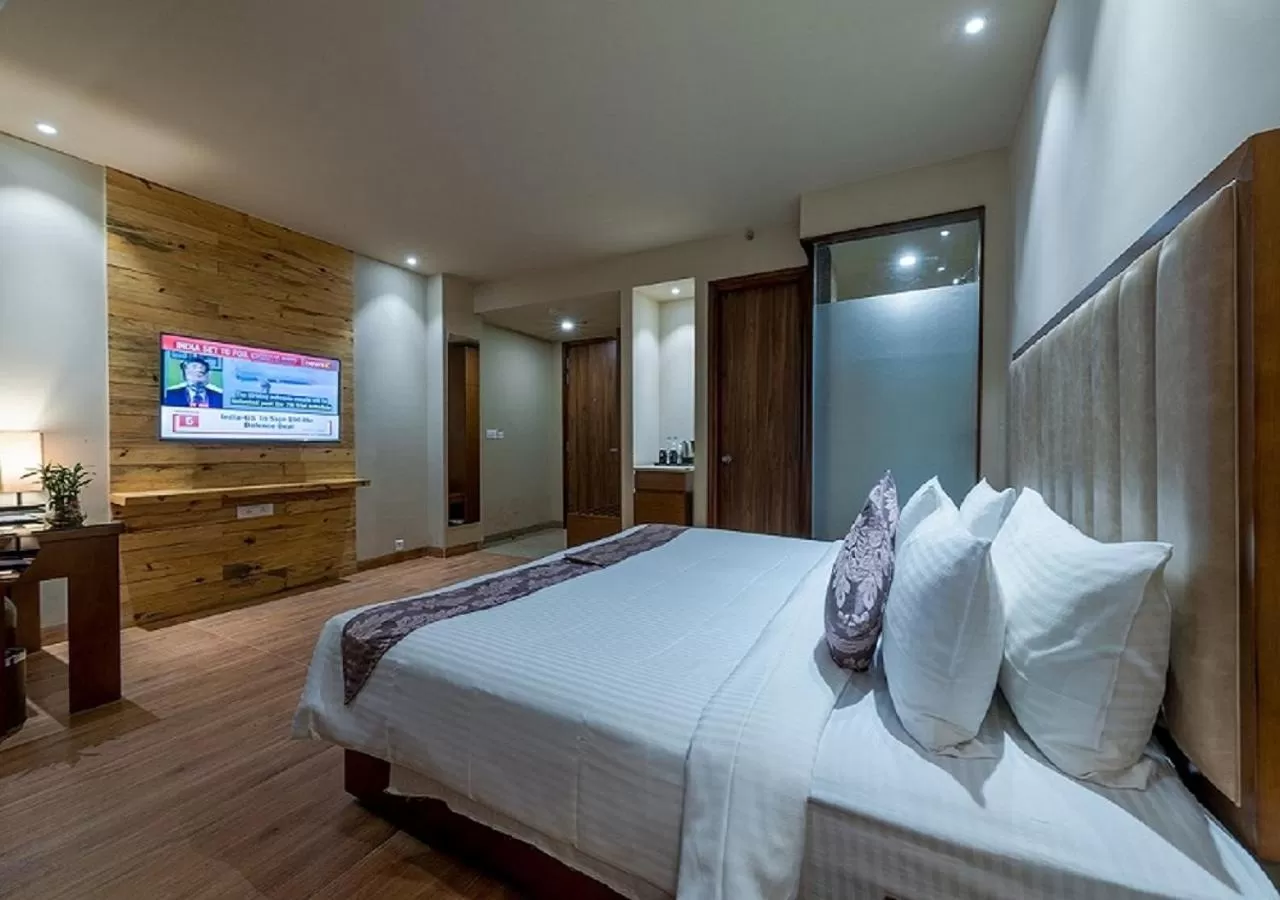 Bed in Hotel Cachar Club