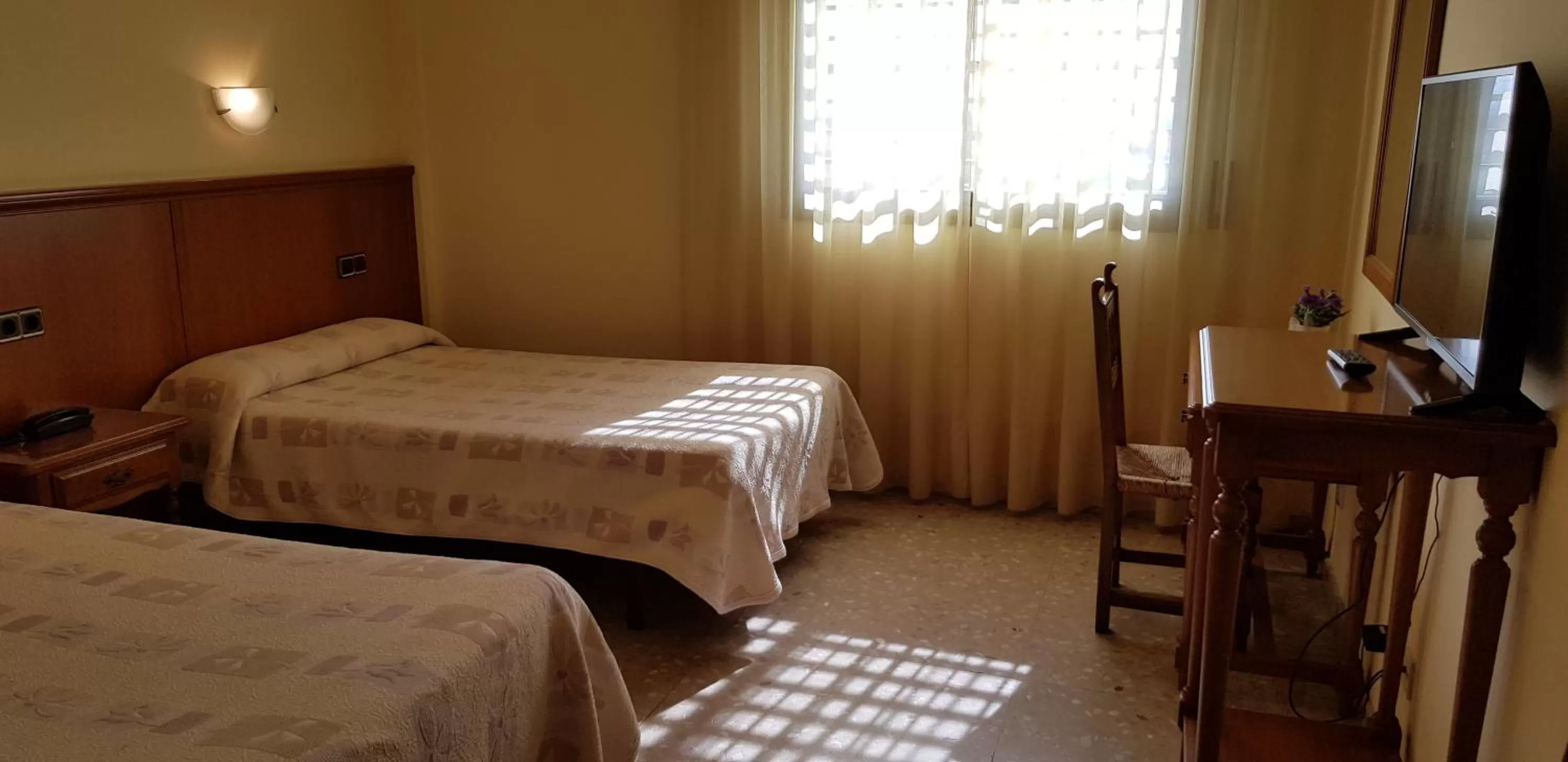 Bed in Hotel Reina Isabel