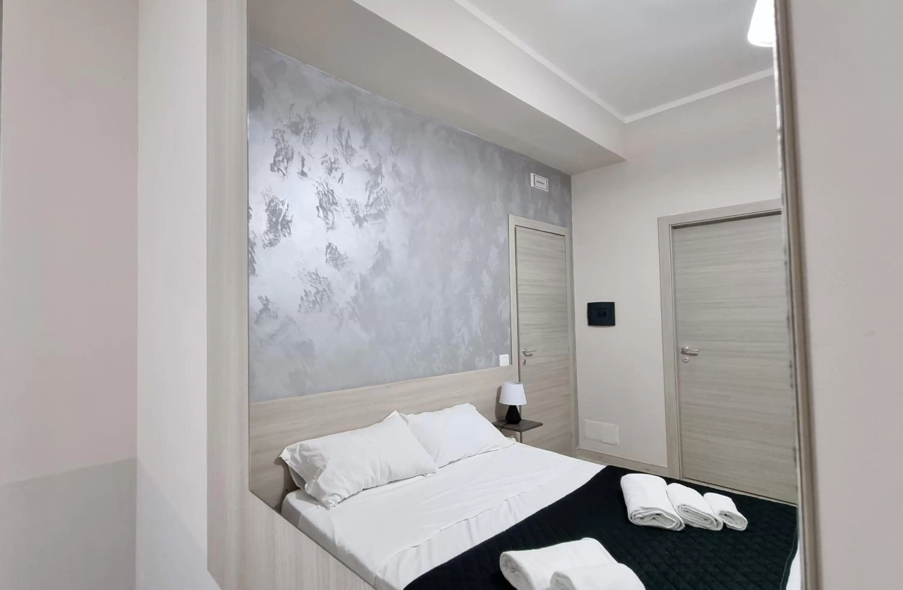 Photo of the whole room, Bed in Residenza Atena