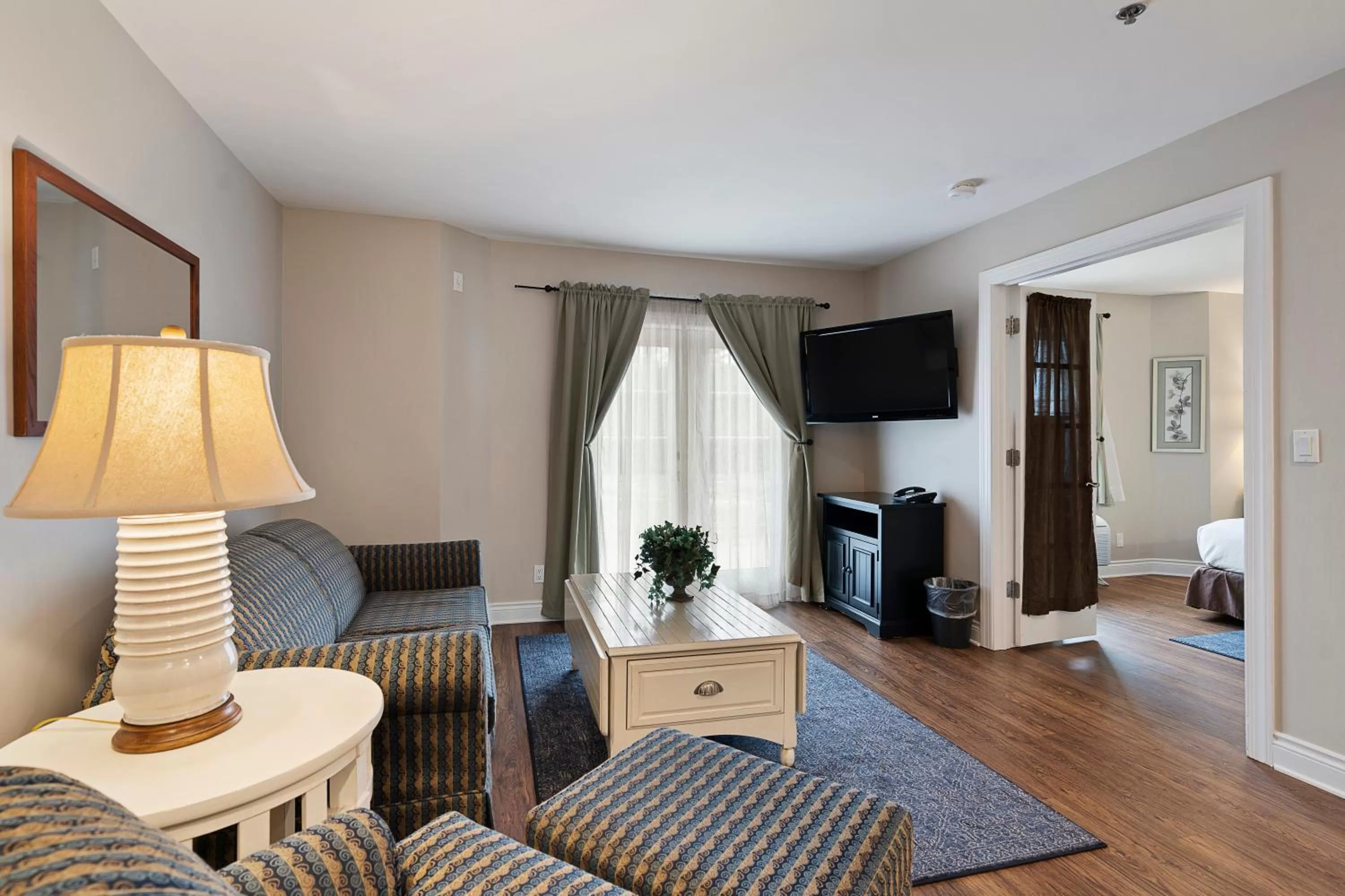 TV and multimedia in Charlevoix Inn & Suites SureStay Collection by Best Western