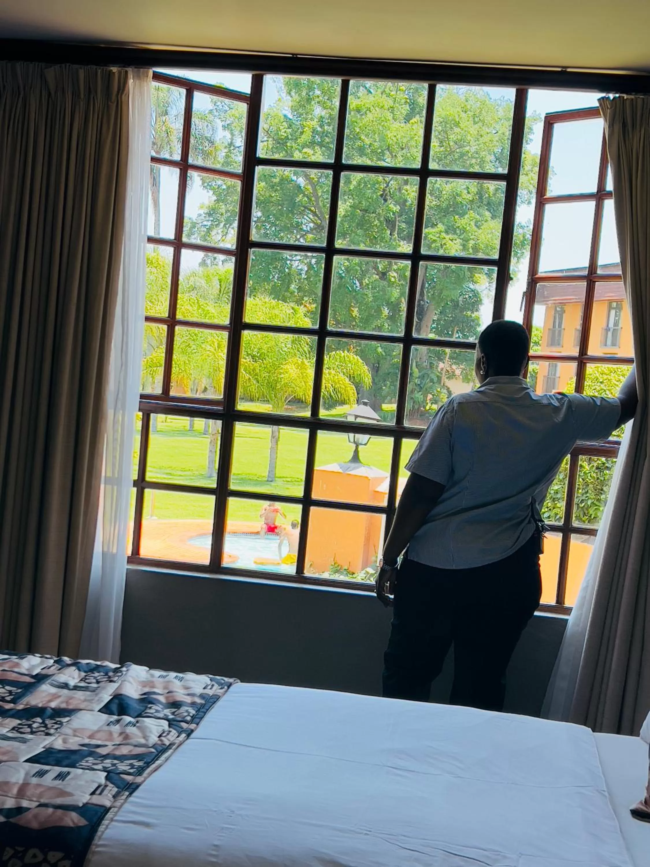 View (from property/room), Bed in African Sky Hotels - Pine Lake Inn