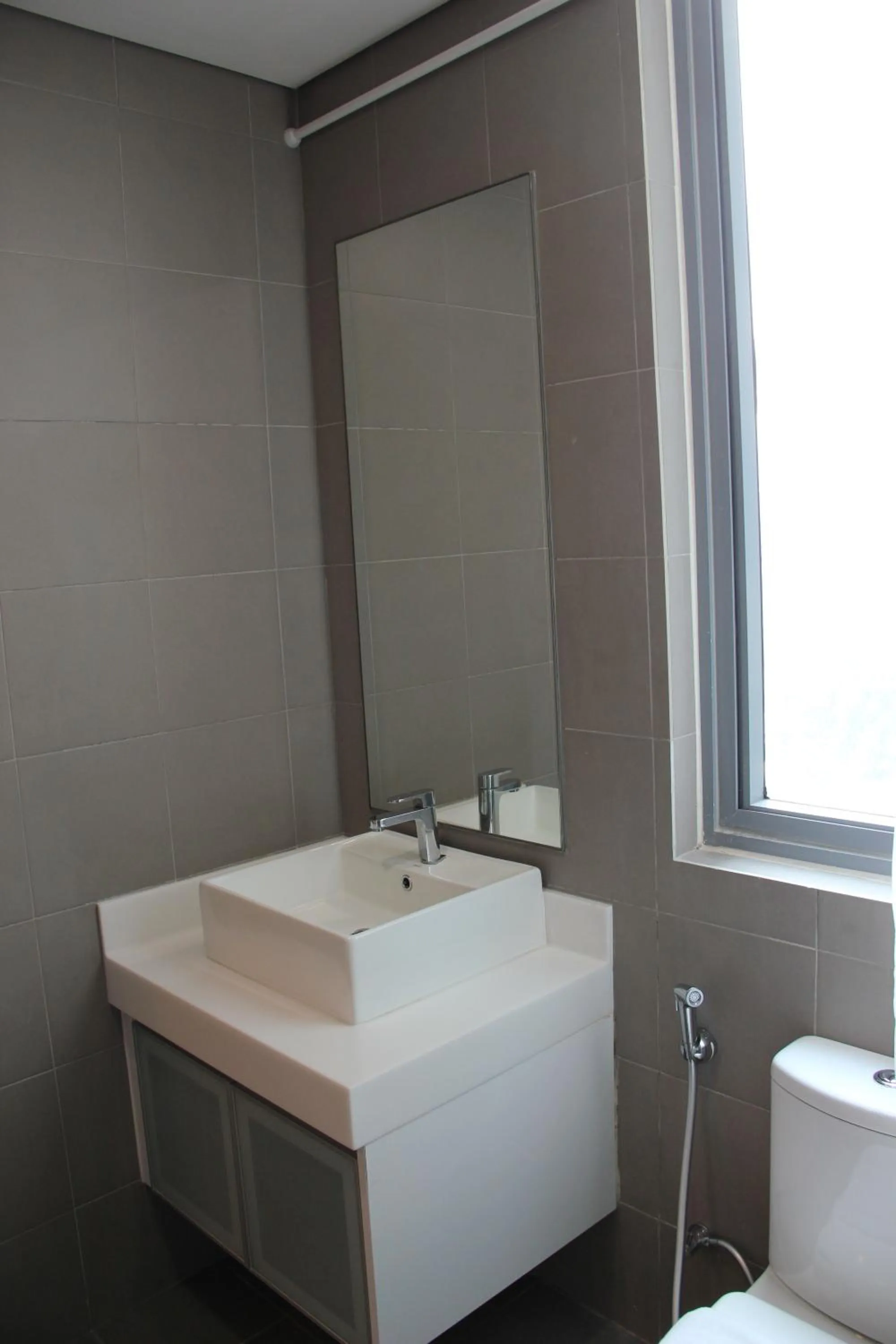 Bathroom in Summer Suites Residences by Subhome