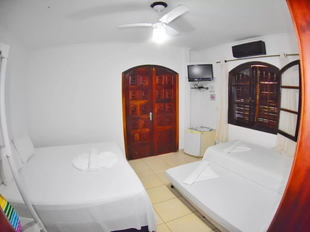 Bed in Pousada Praia do Tombo