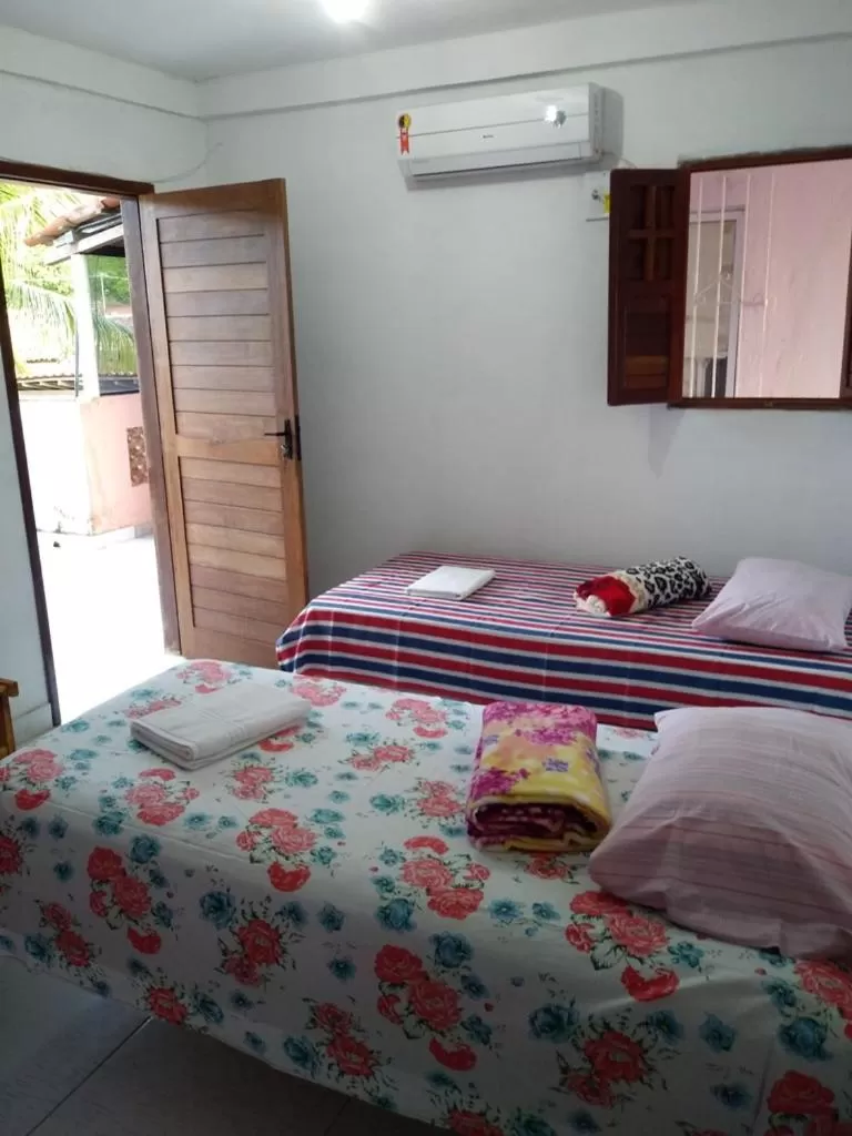 Bed in Pousada dos Ventos