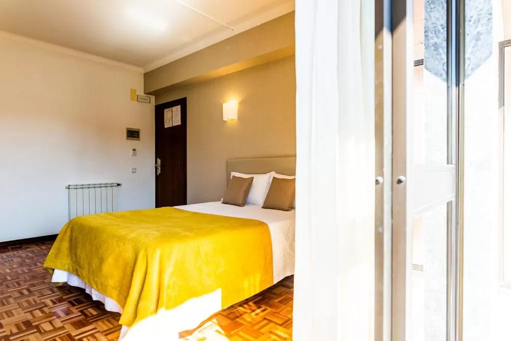 Bed in Dona Amélia Hotel by RIDAN Hotels