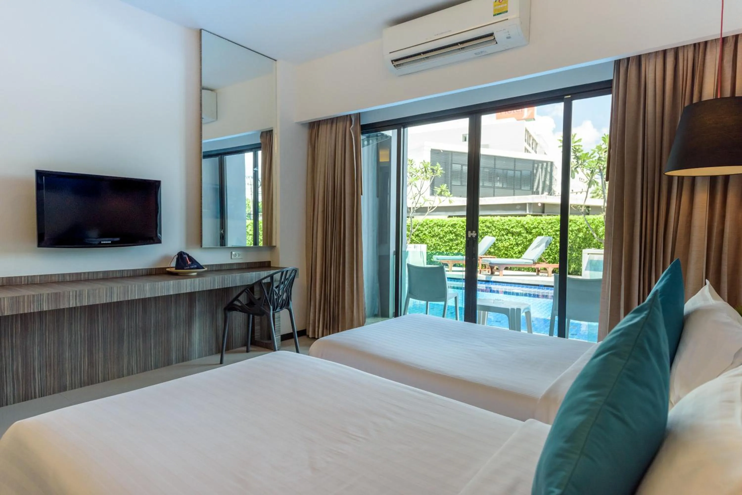 Bed in Hotel J Residence Pattaya