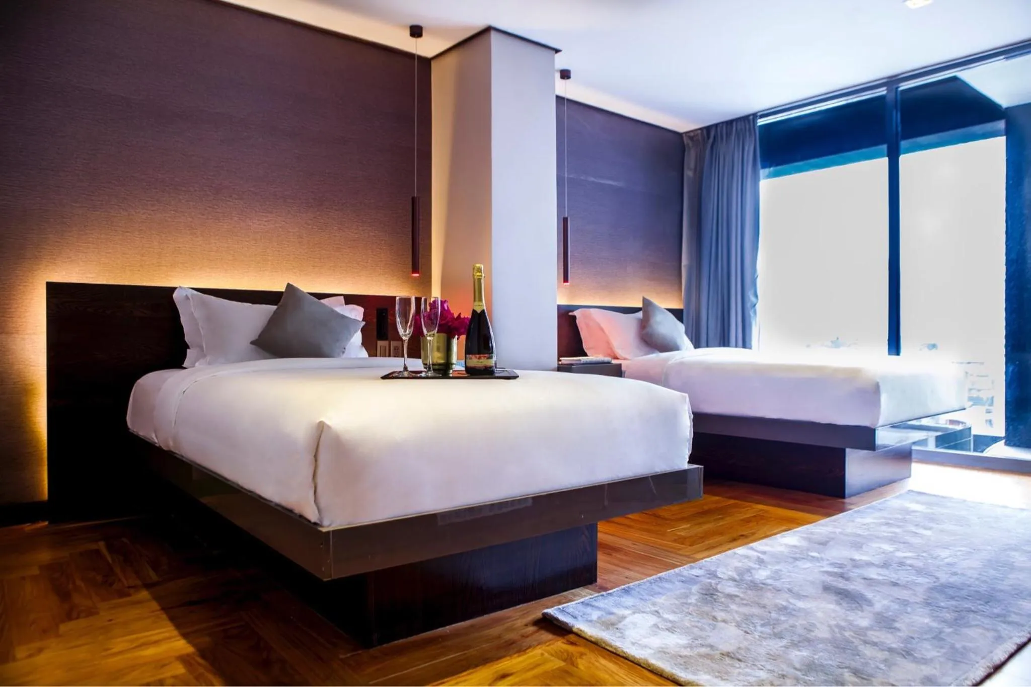 Bed in Ramada Encore by Wyndham Makati