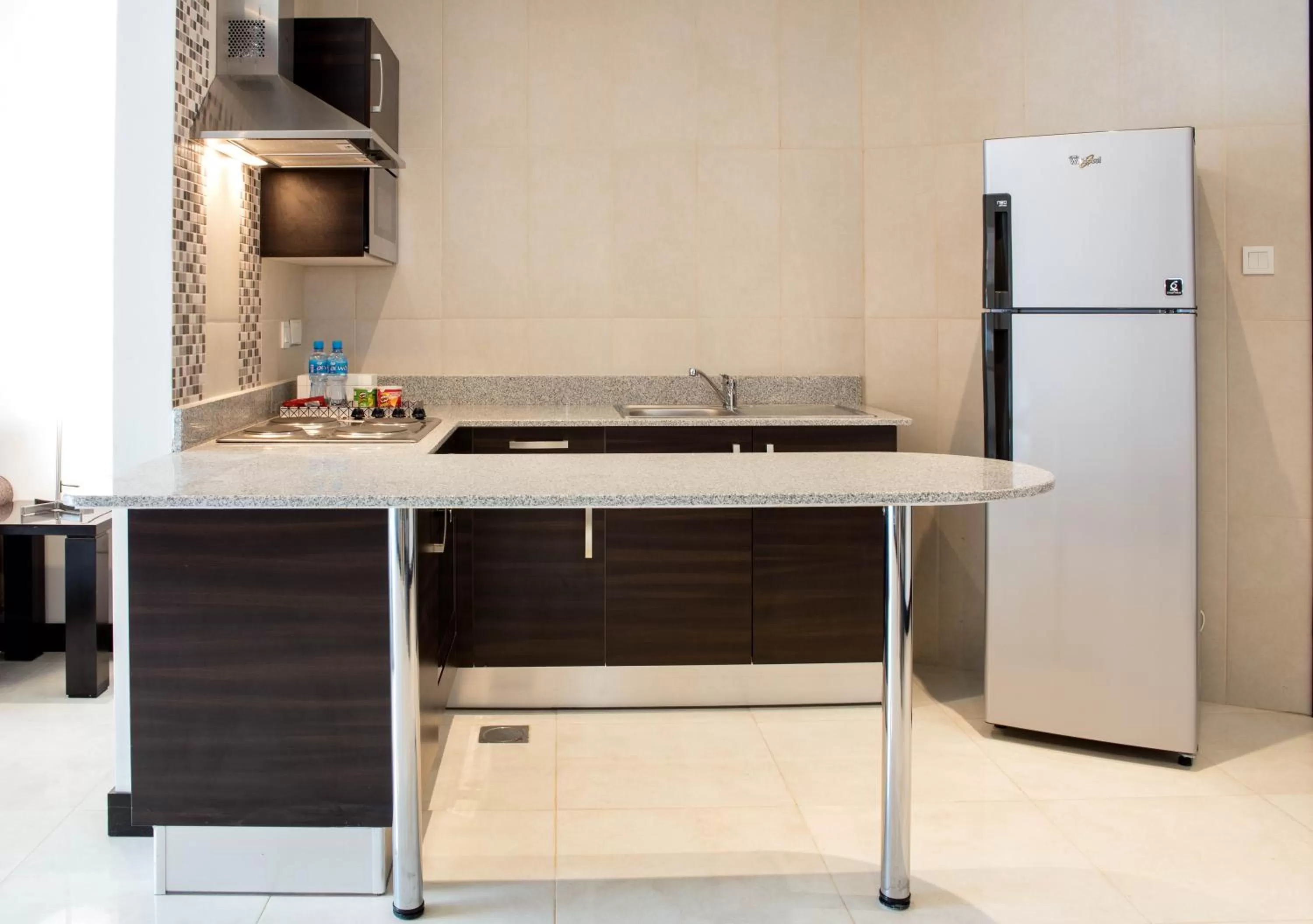Kitchen or kitchenette in Loumage S Suites and Spa