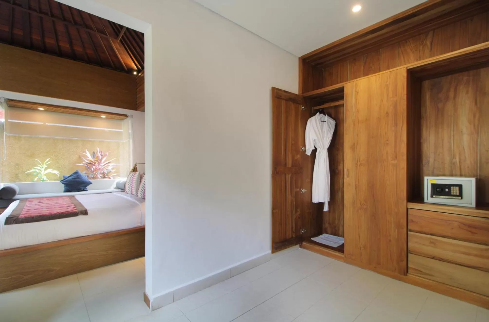 wardrobe, Bed in Sagara Villas and Suites Sanur by AHM