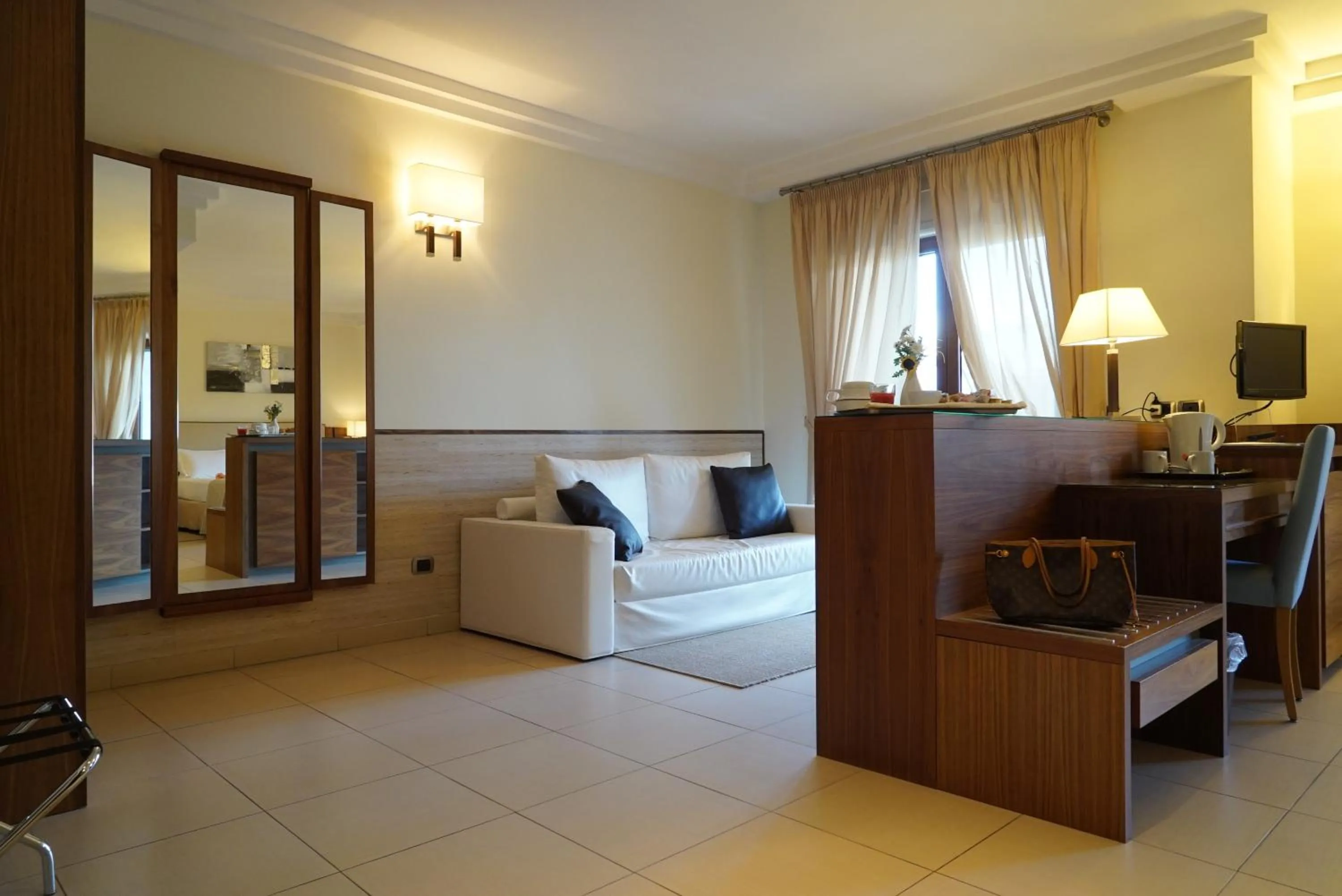 Photo of the whole room, Bed in Suites & Residence Hotel