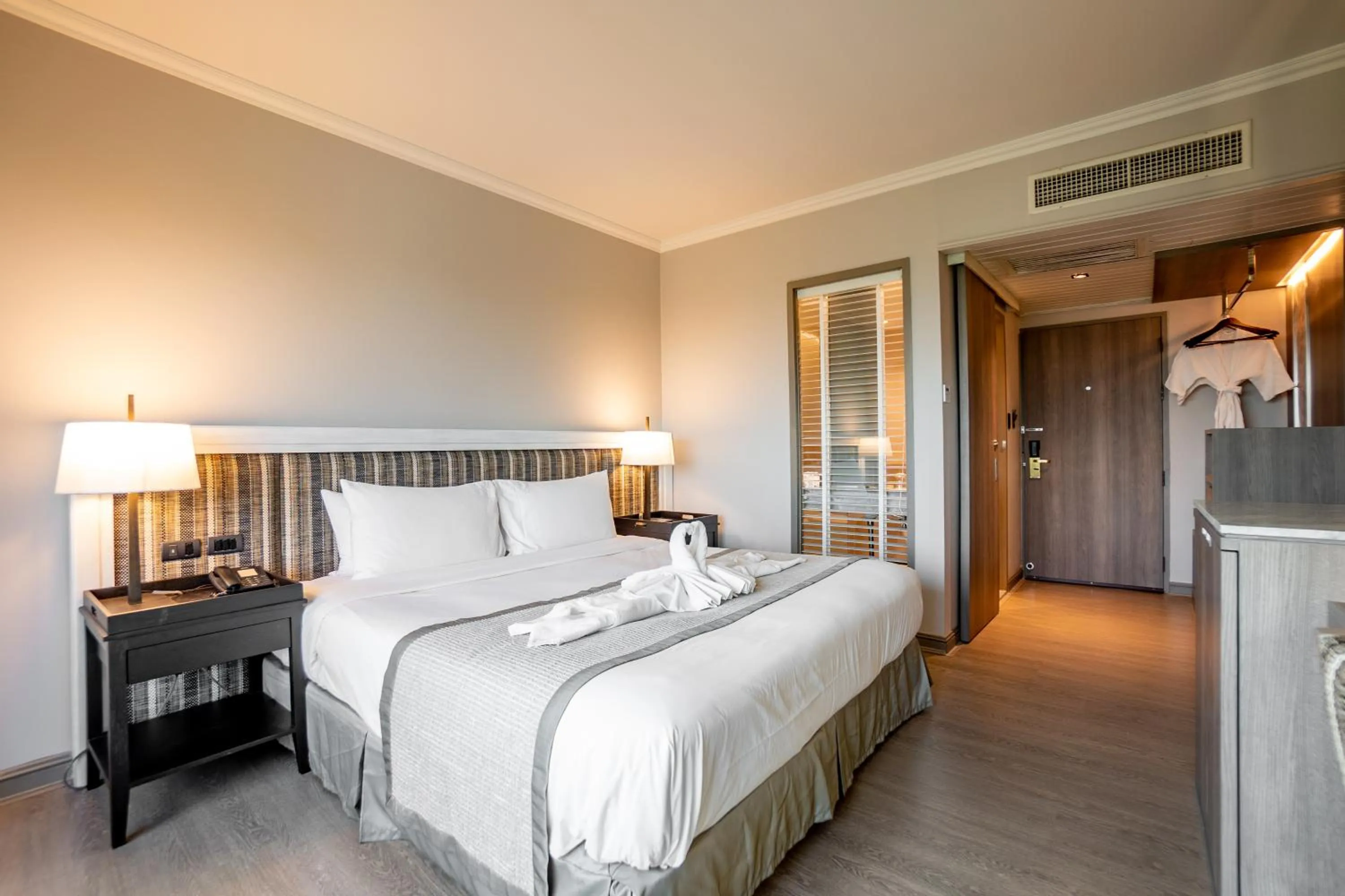 Bed in The Grand Riverside Hotel