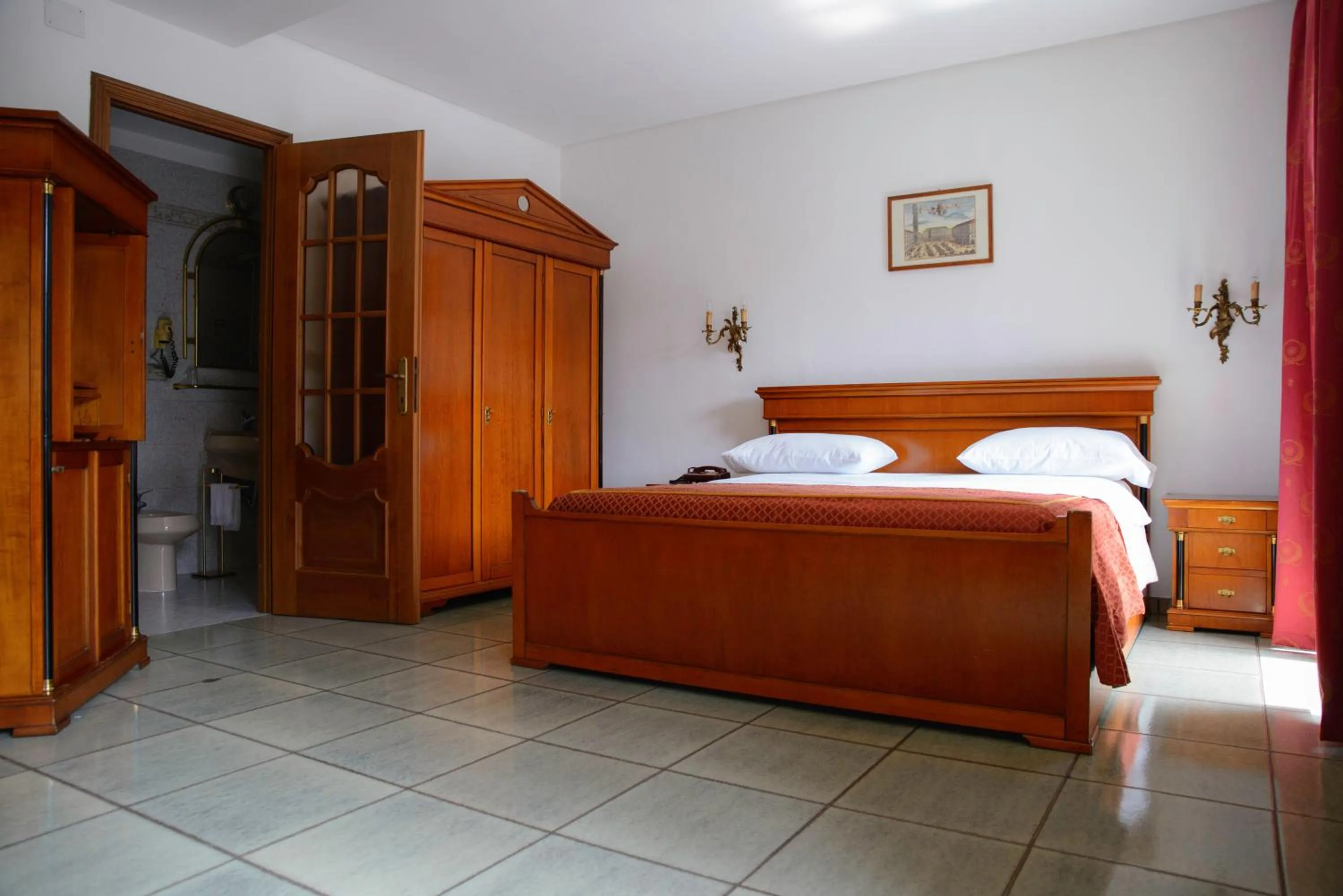 Photo of the whole room in Affittacamere Maison Napoleon