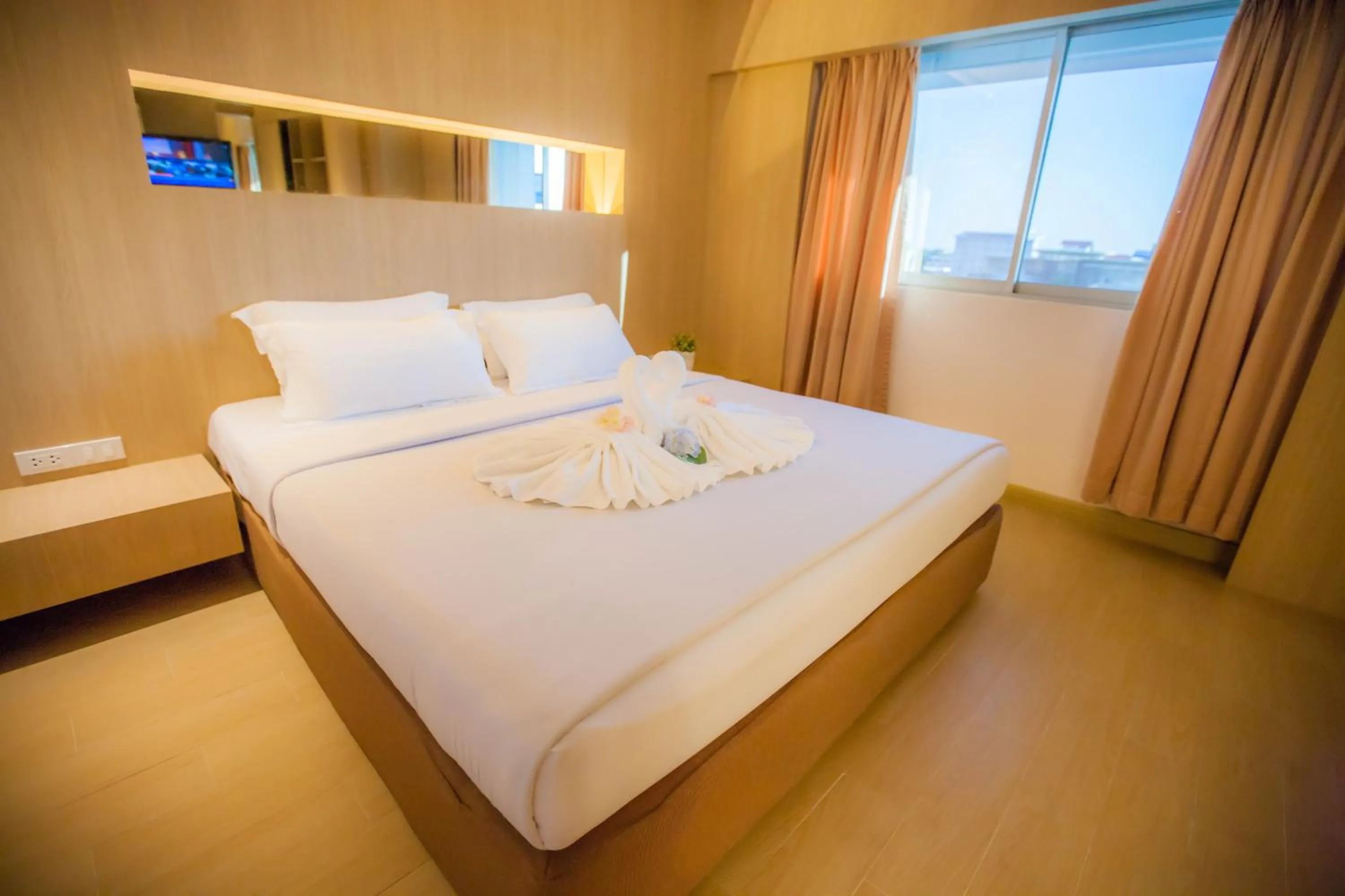 Bed in Golden City Rayong Hotel