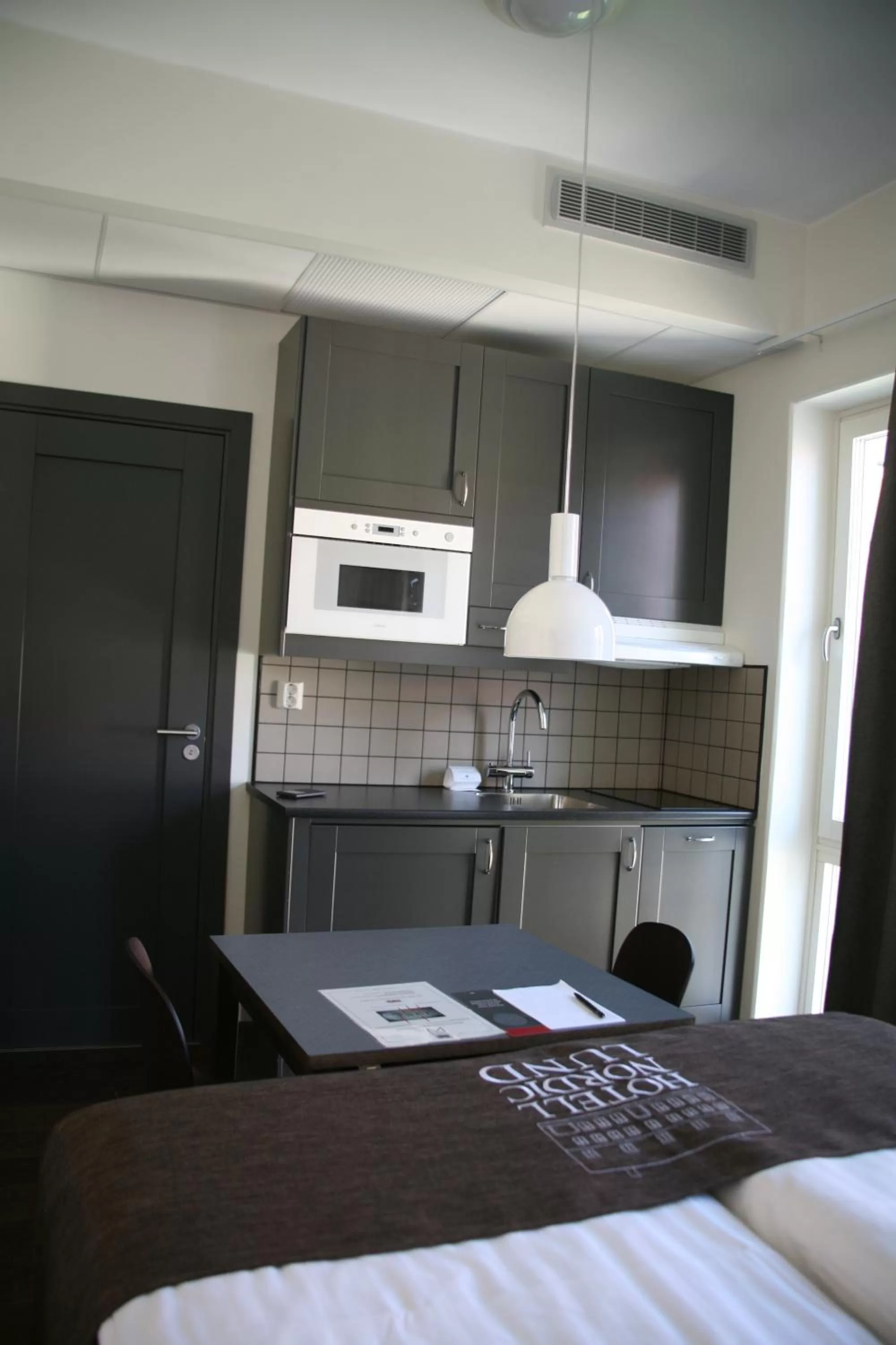 Kitchen or kitchenette, Bed in Best Western Plus Hotell Nordic Lund