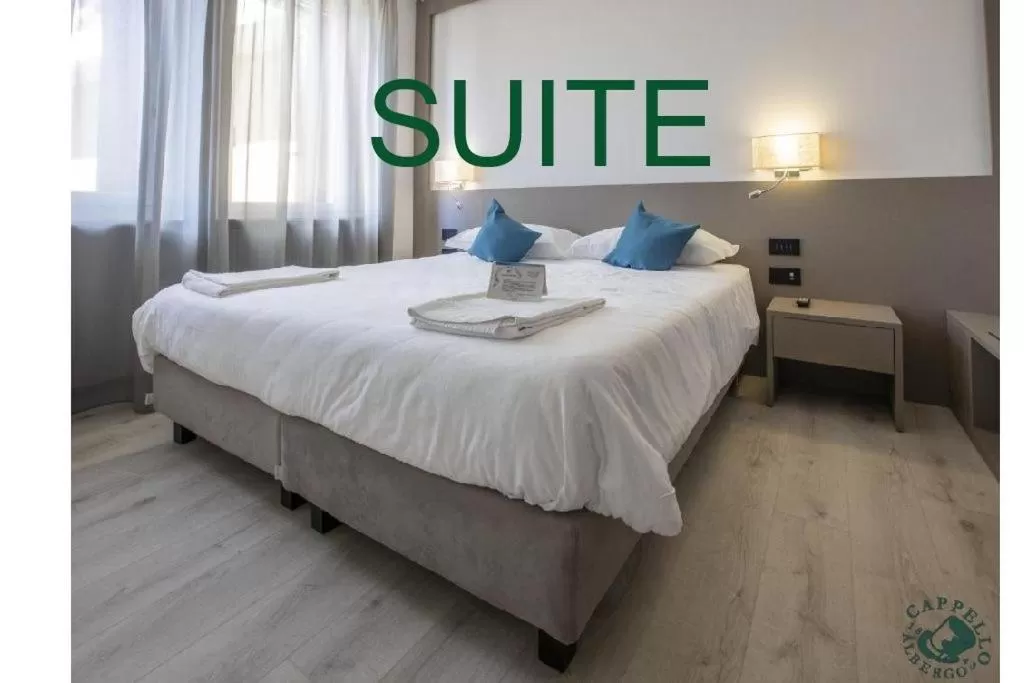 Bed in Albergo Cappello e Cadore