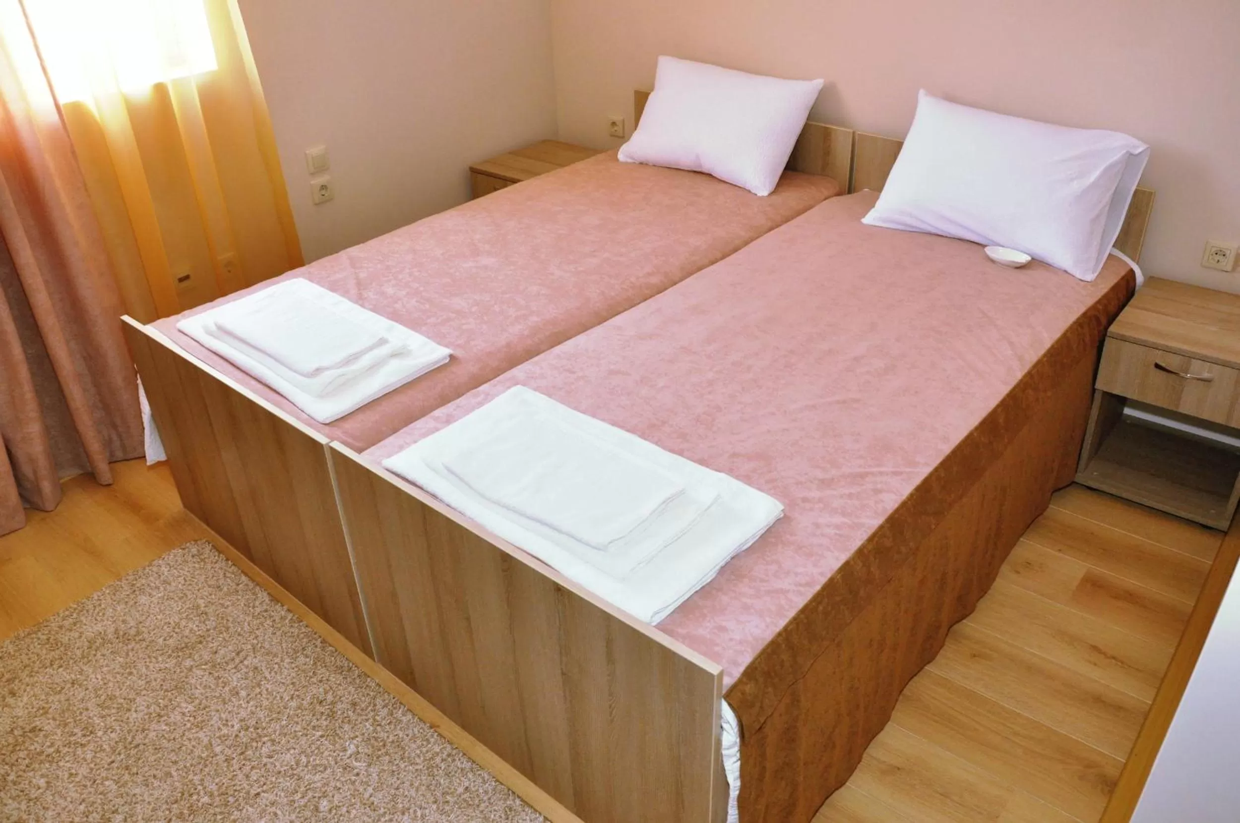 Bed in Garni Hotel Tri O
