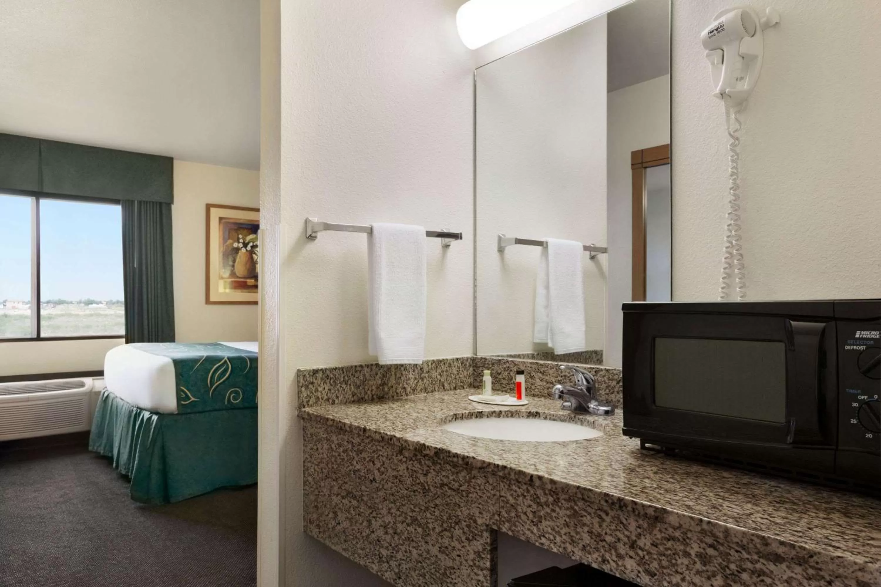 Bathroom, Bed in Travelodge by Wyndham Pecos