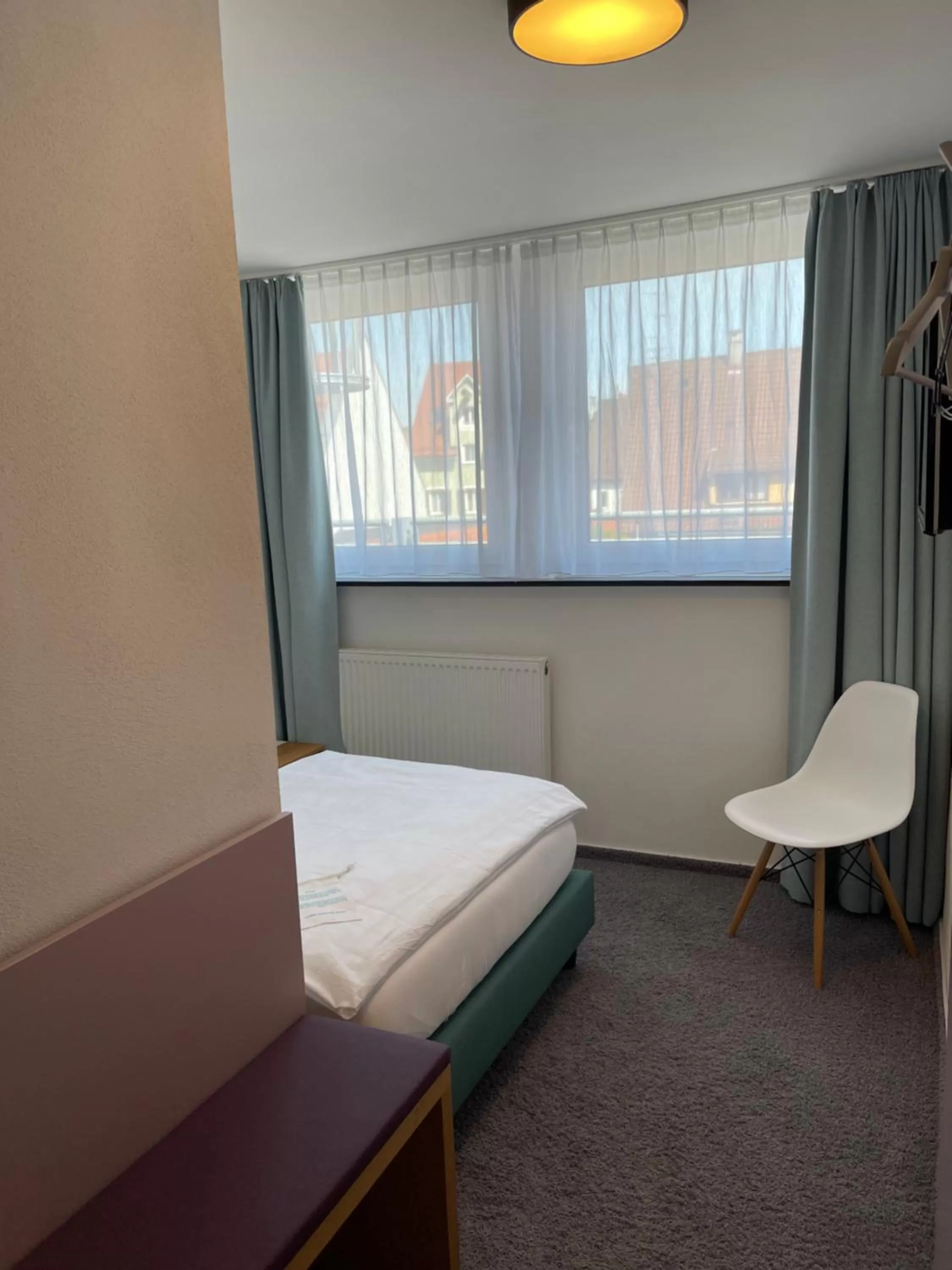 Photo of the whole room, Bed in Ulmer Münster Hotel