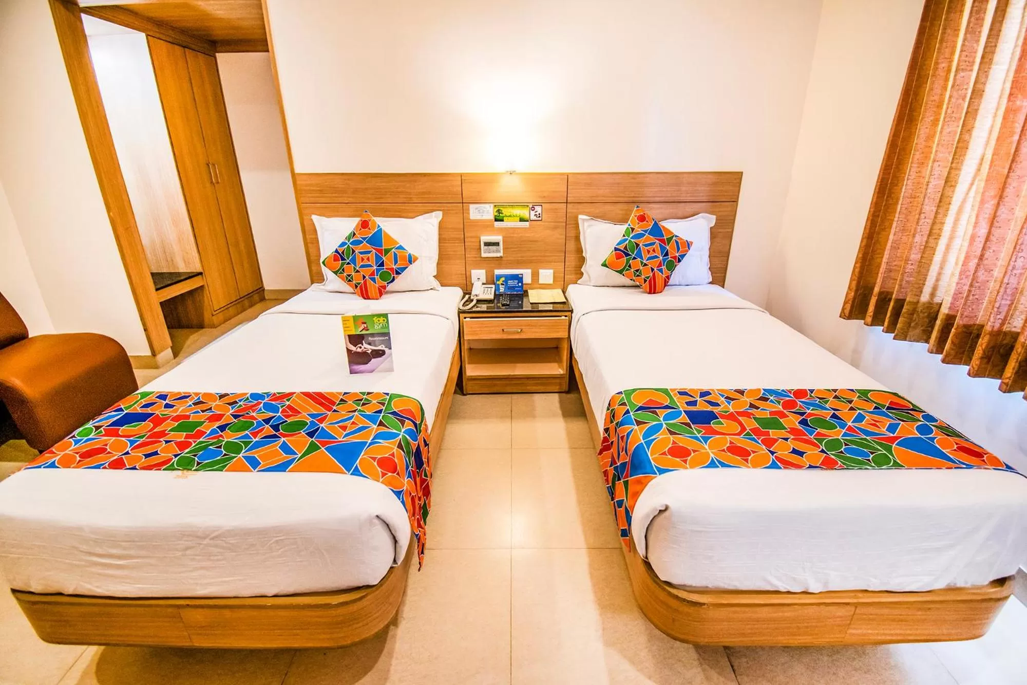 Living room, Bed in FabHotel Prime Royal Castle Gandhipuram