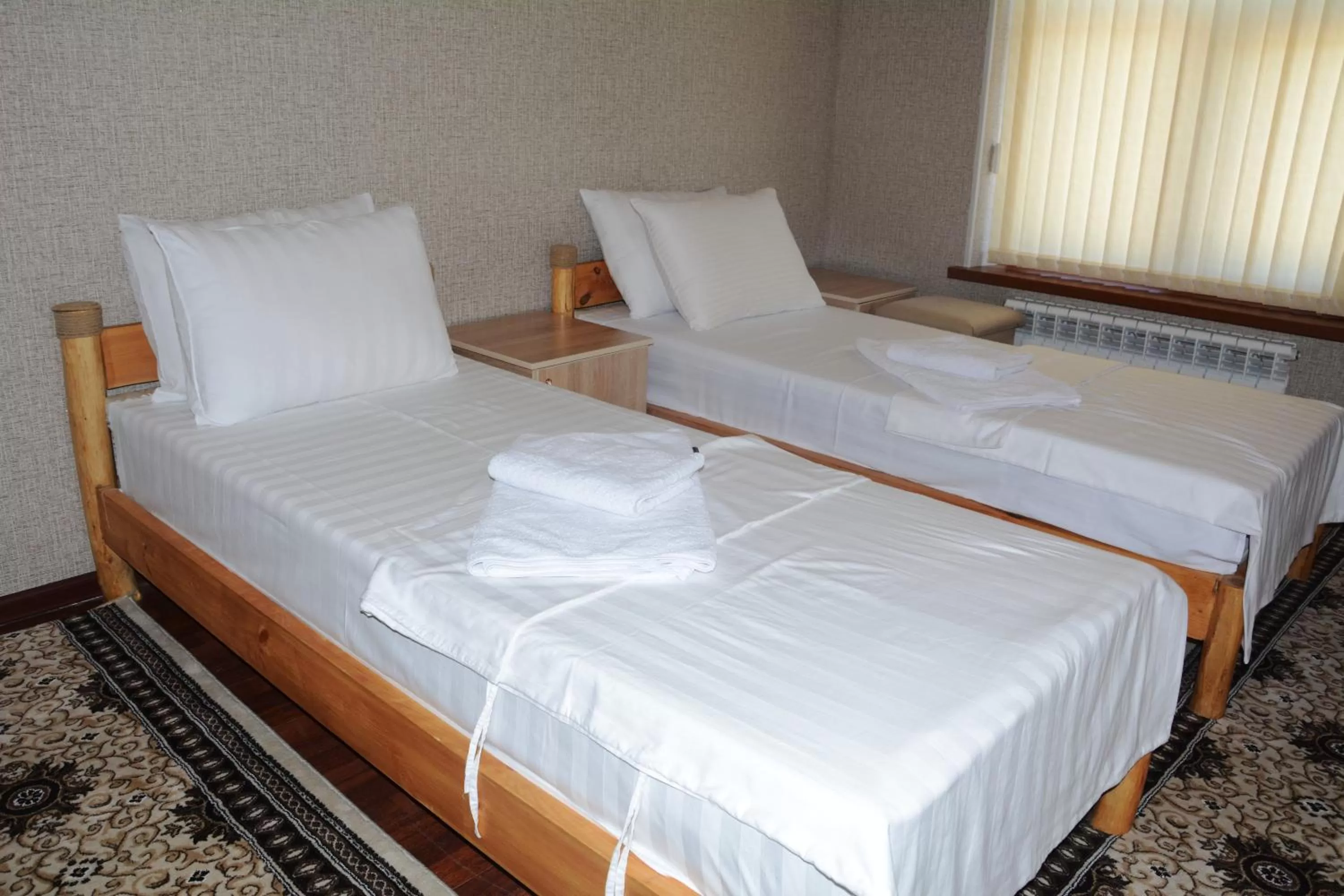 Bed in Alisher B&B Chorbog'