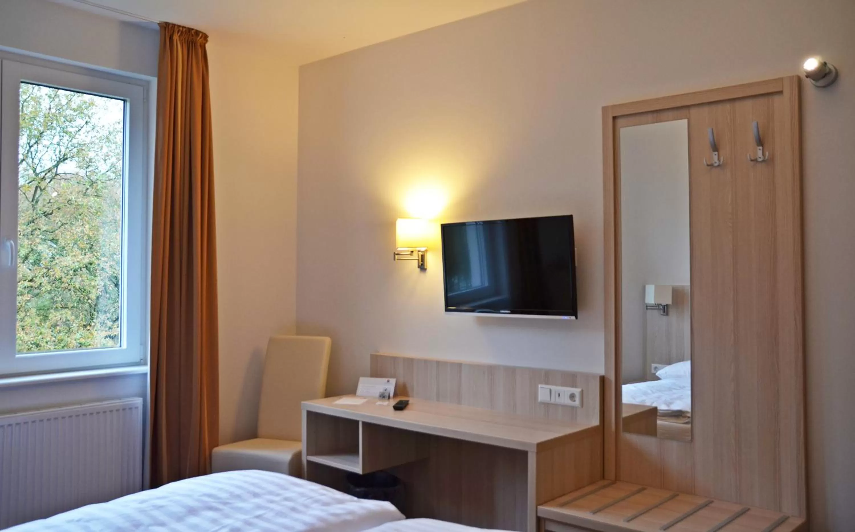 Photo of the whole room, Bed in Hotel Quickborn & Gästehaus Hesse