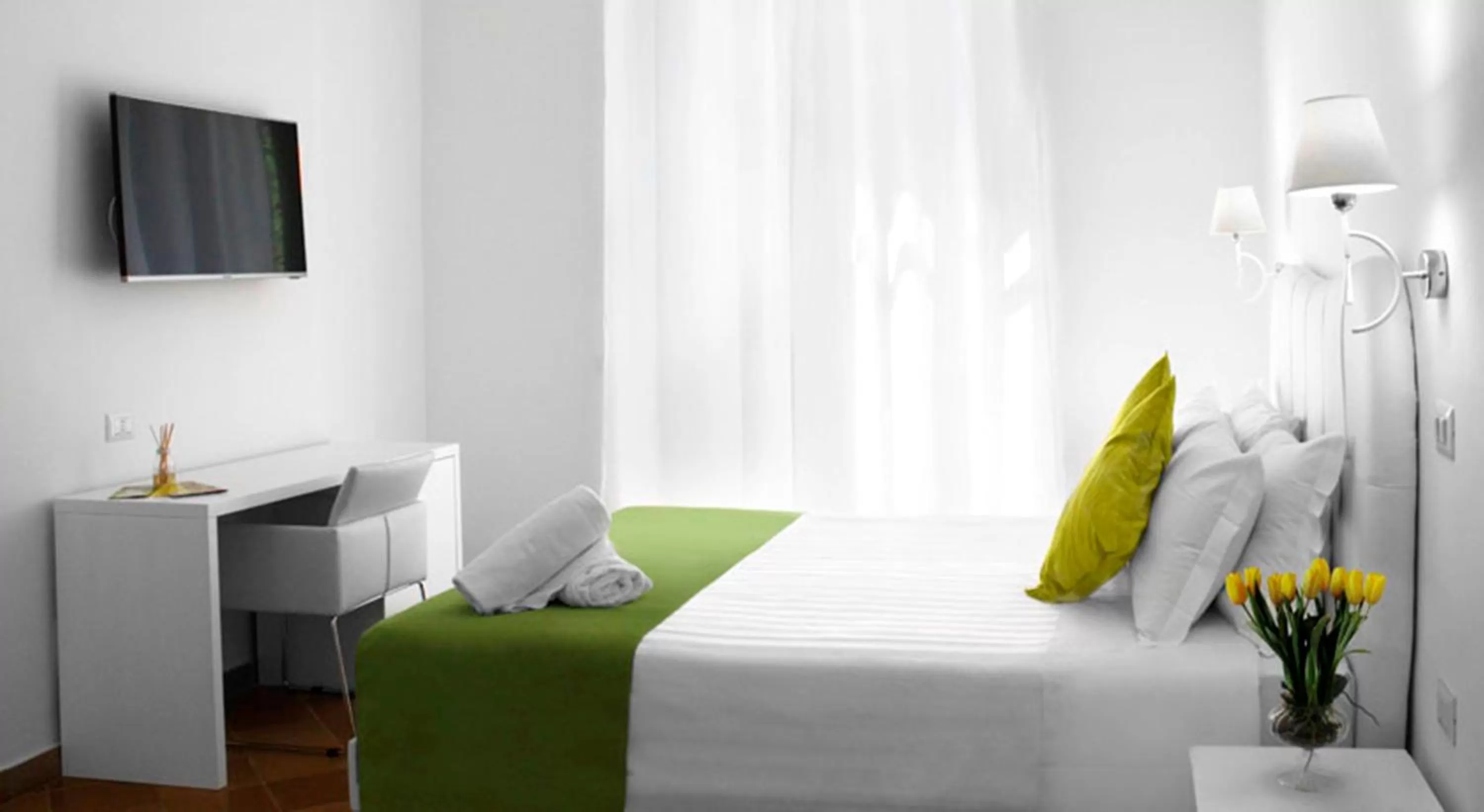 Bed in Roma Resort Colosseum