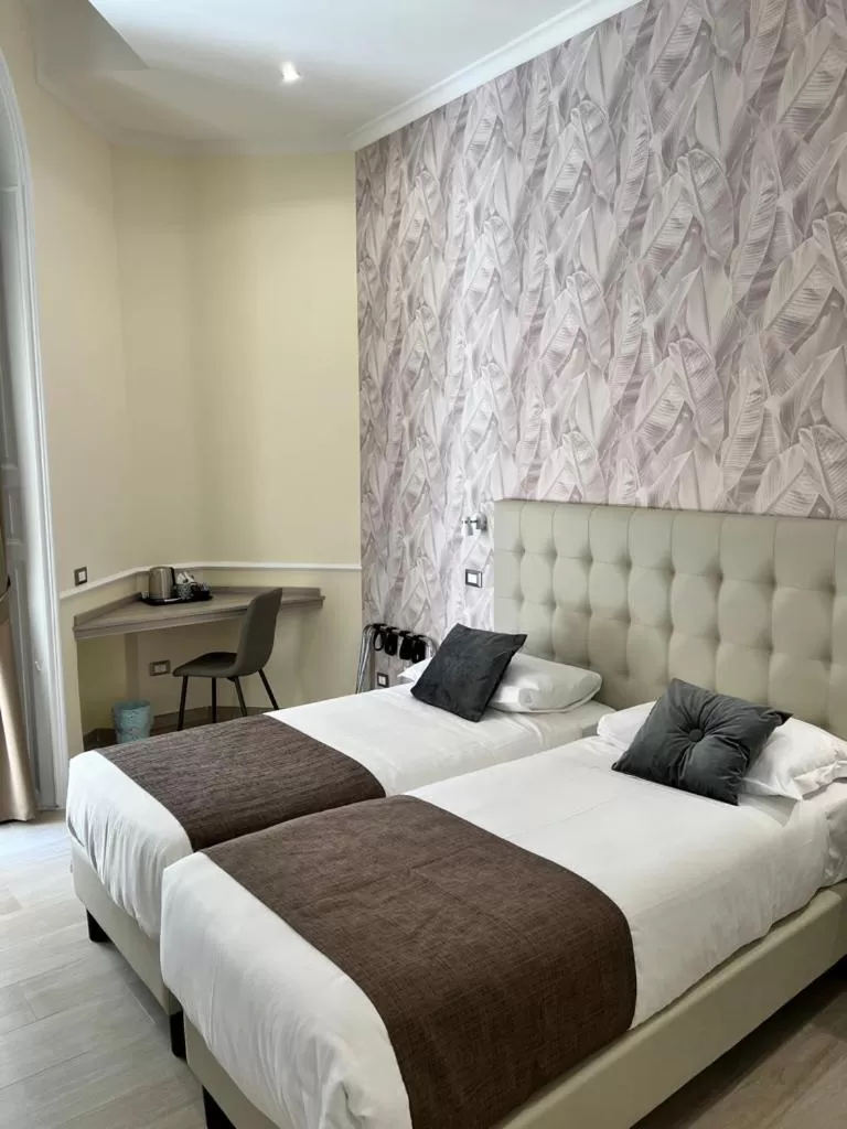 Bed in Hotel Le Petit