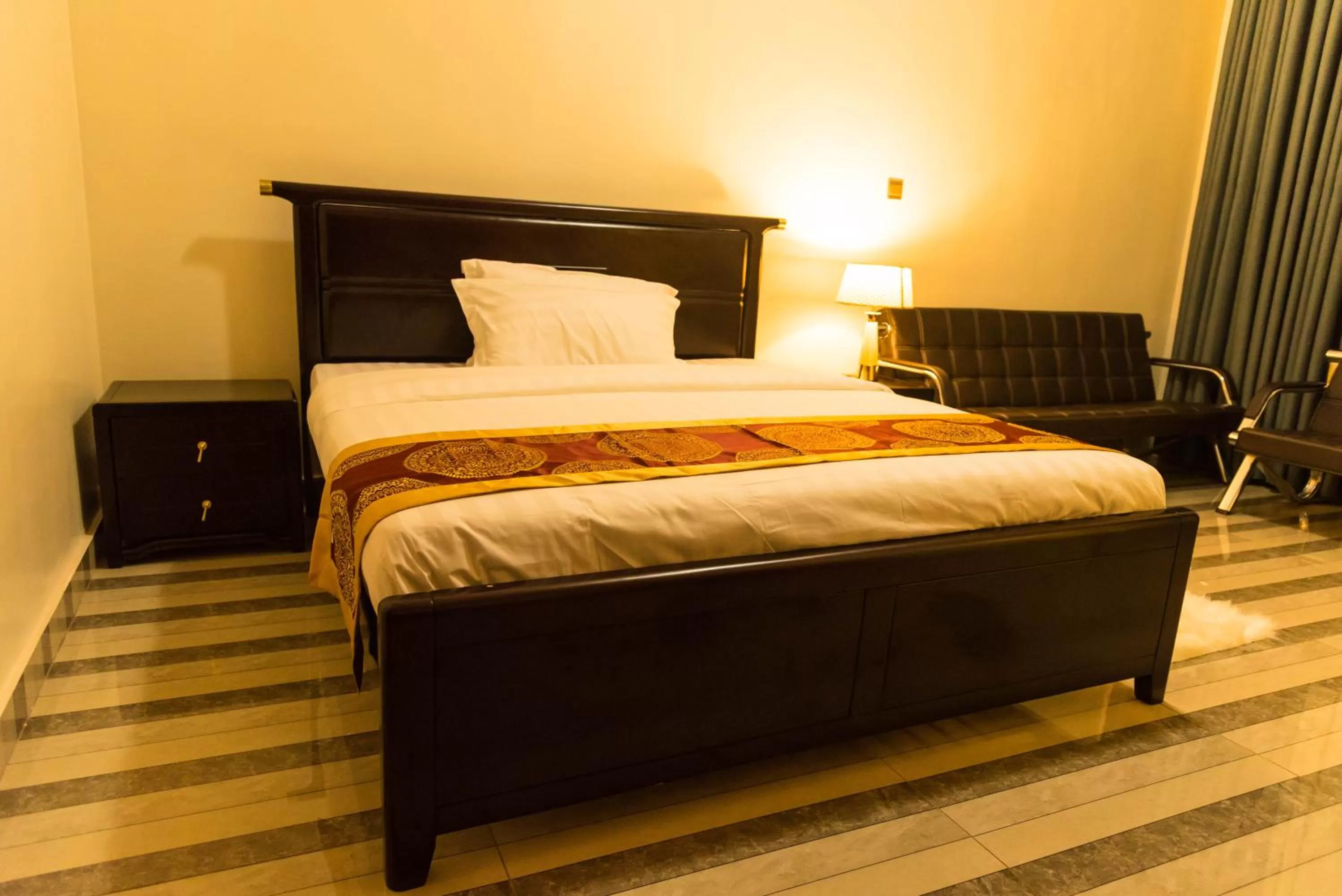 Bed in AVISHA TOWN HOTEL