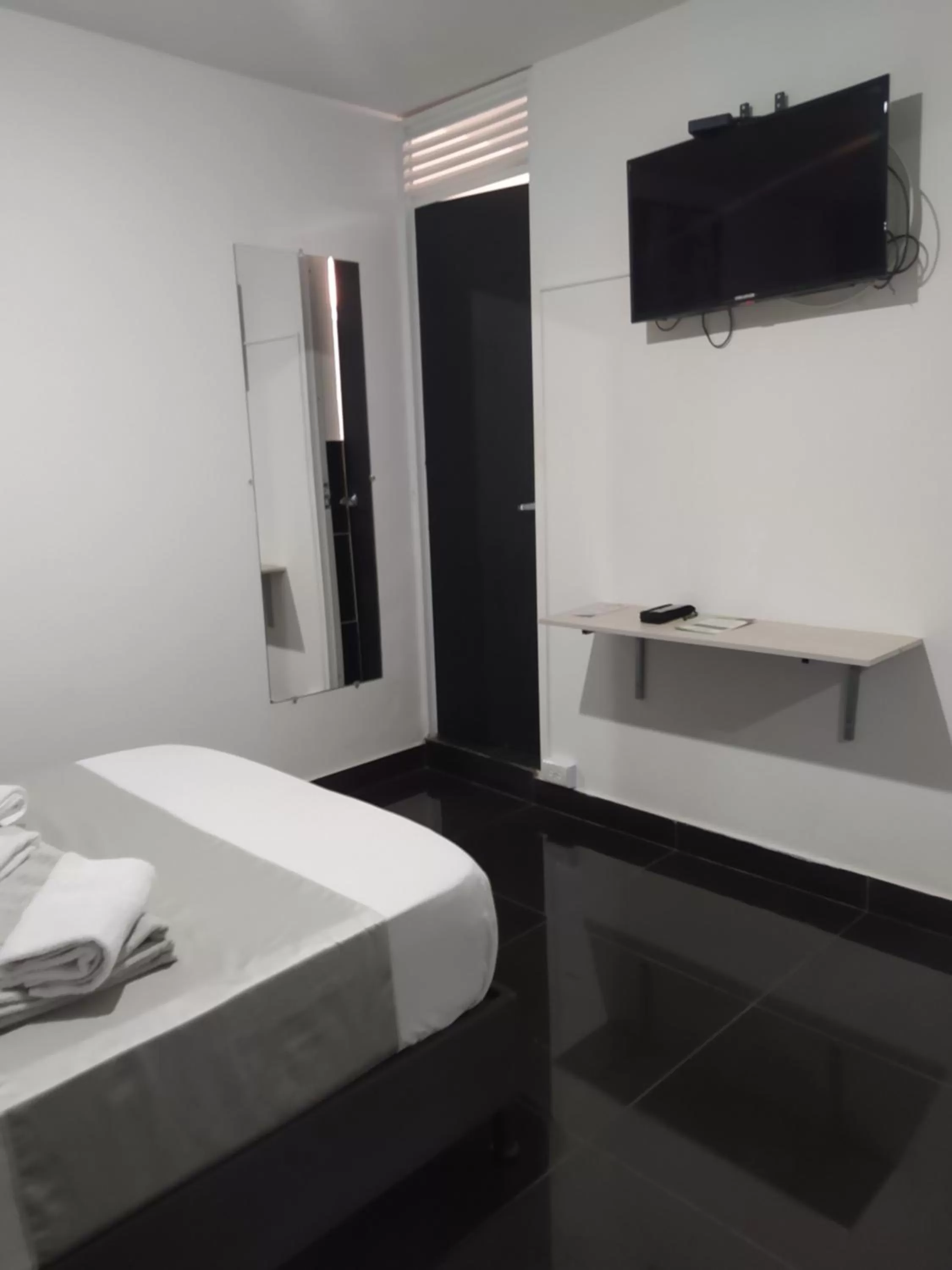 Bed, Bathroom in Hotel Aura Medellin