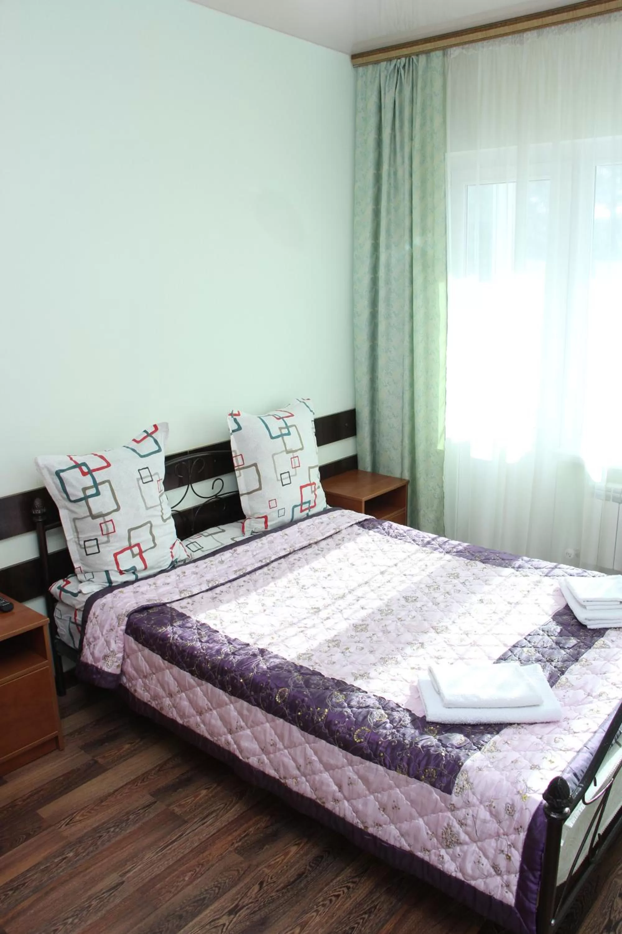 Bed in Zhaylau Hotel