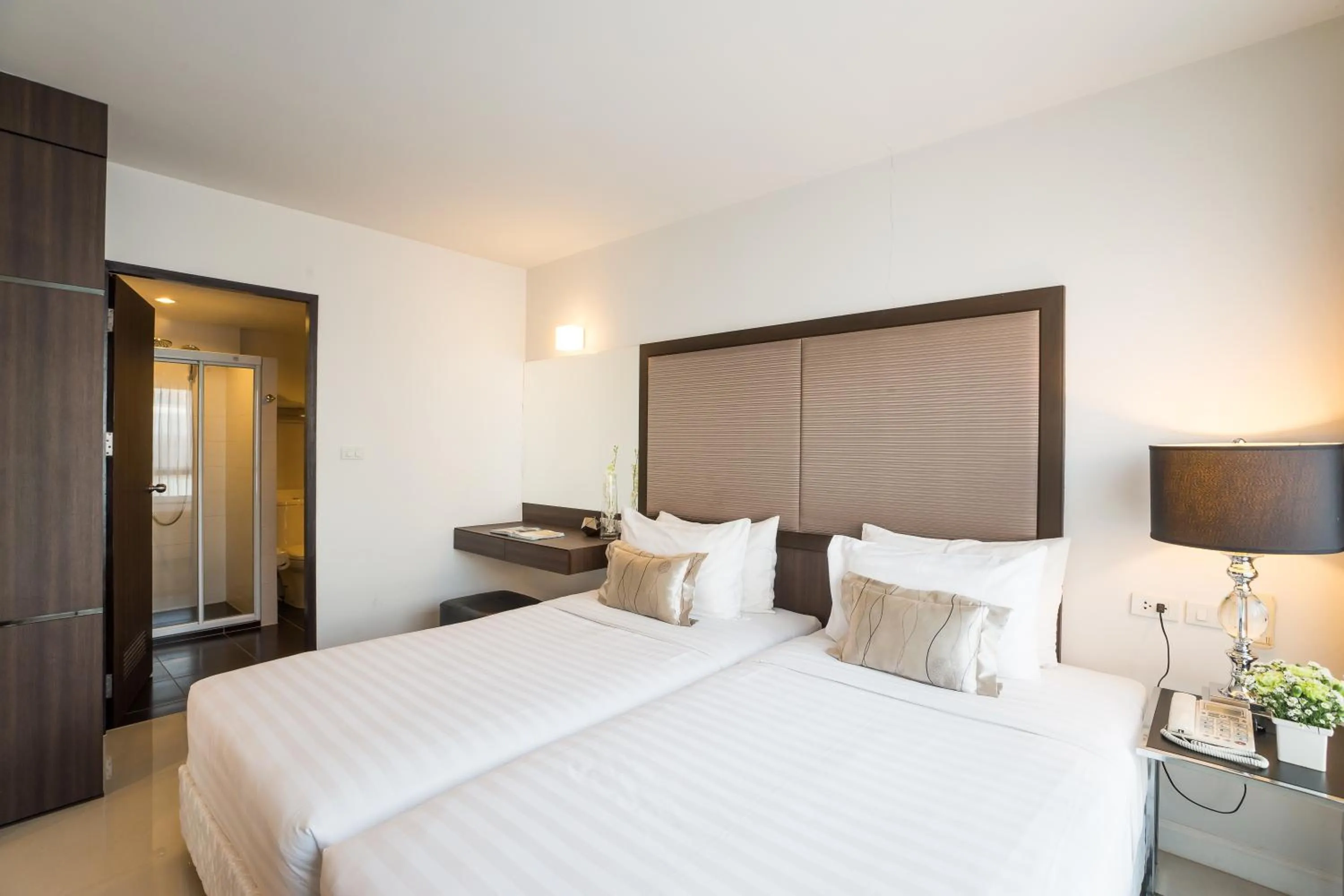 Photo of the whole room, Bed in Beyond Suite