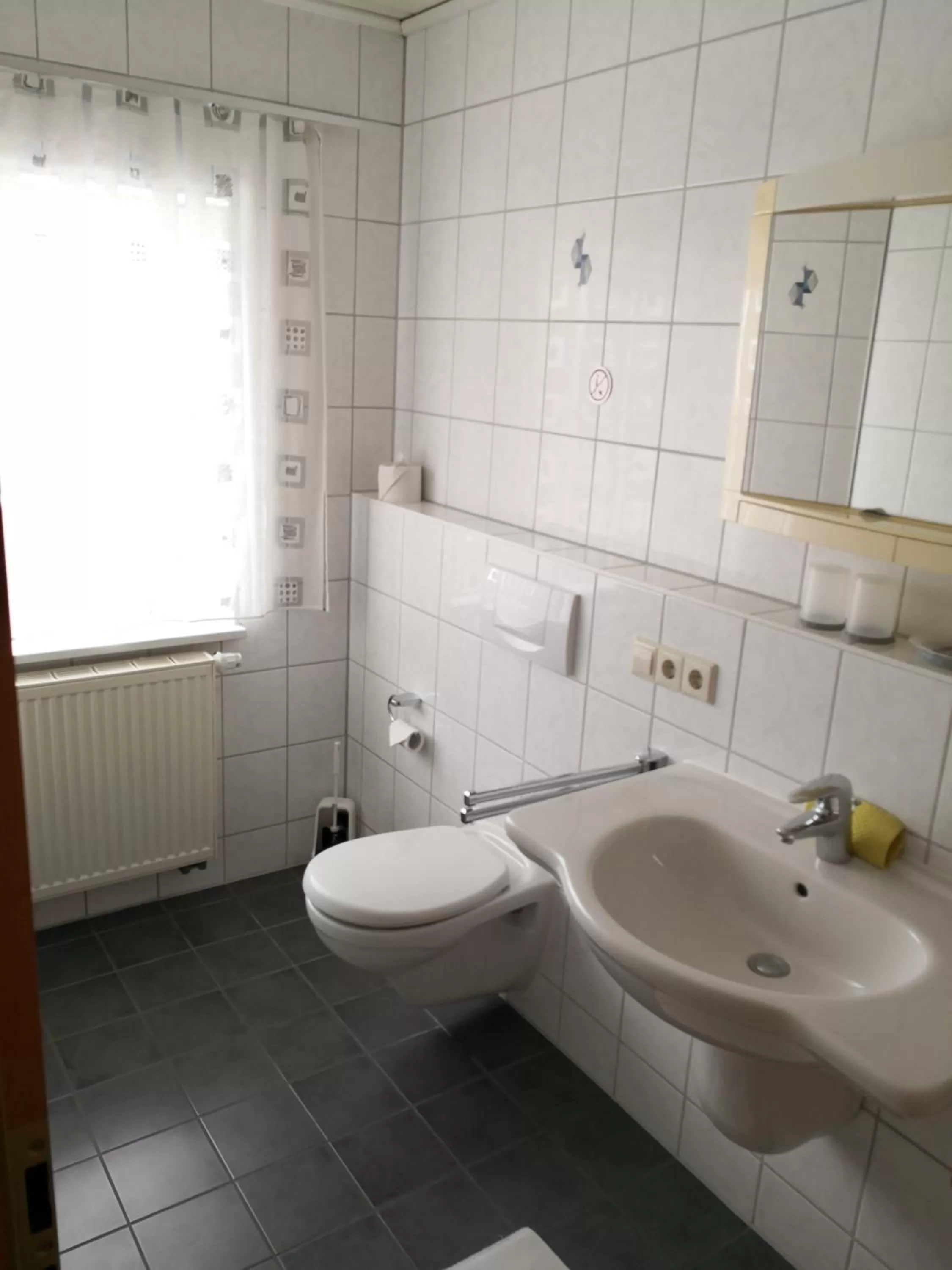 Bathroom in Gästehaus und Fewo Lamm Garni