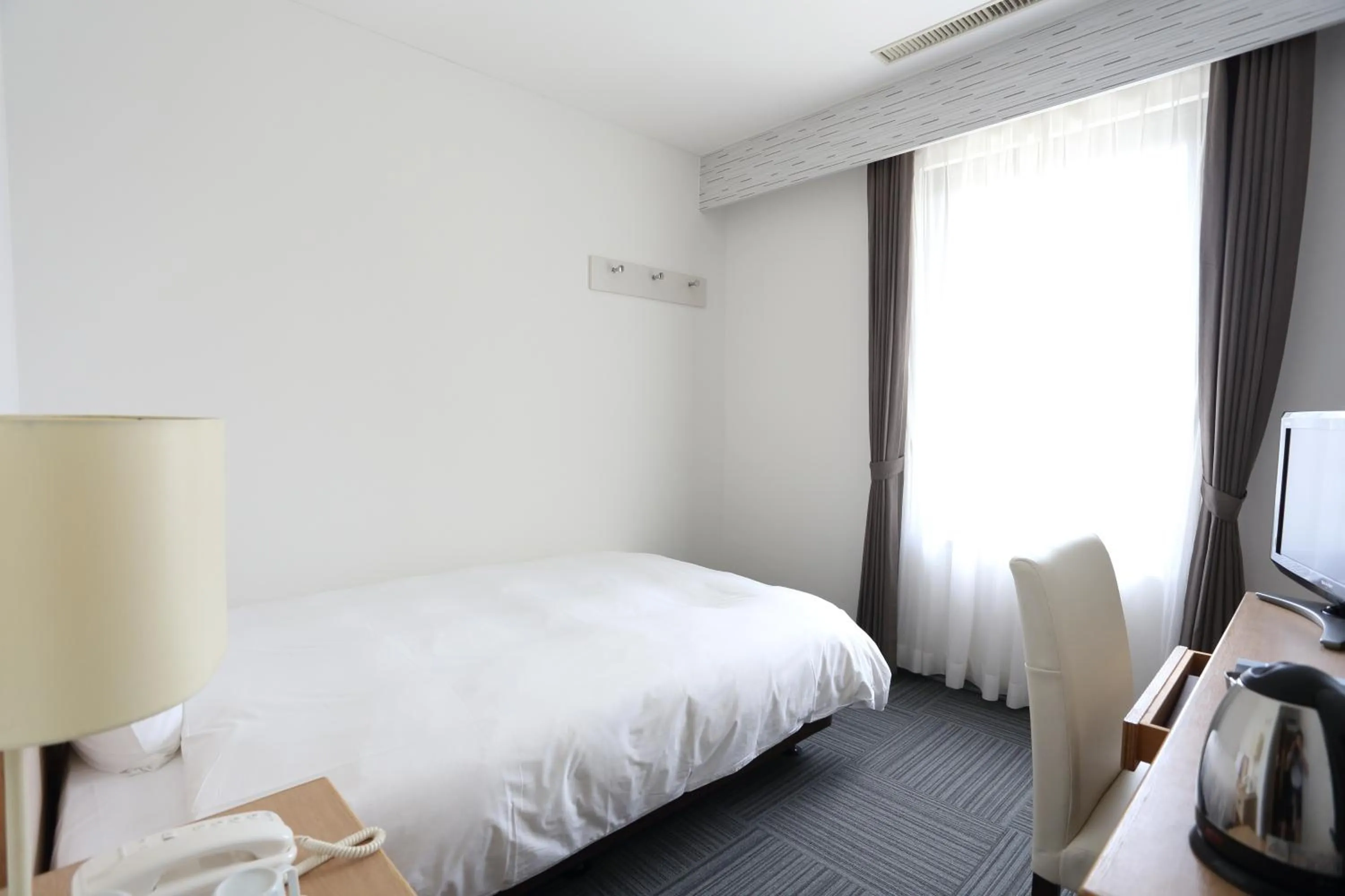 Bed in Hotel International House Osaka